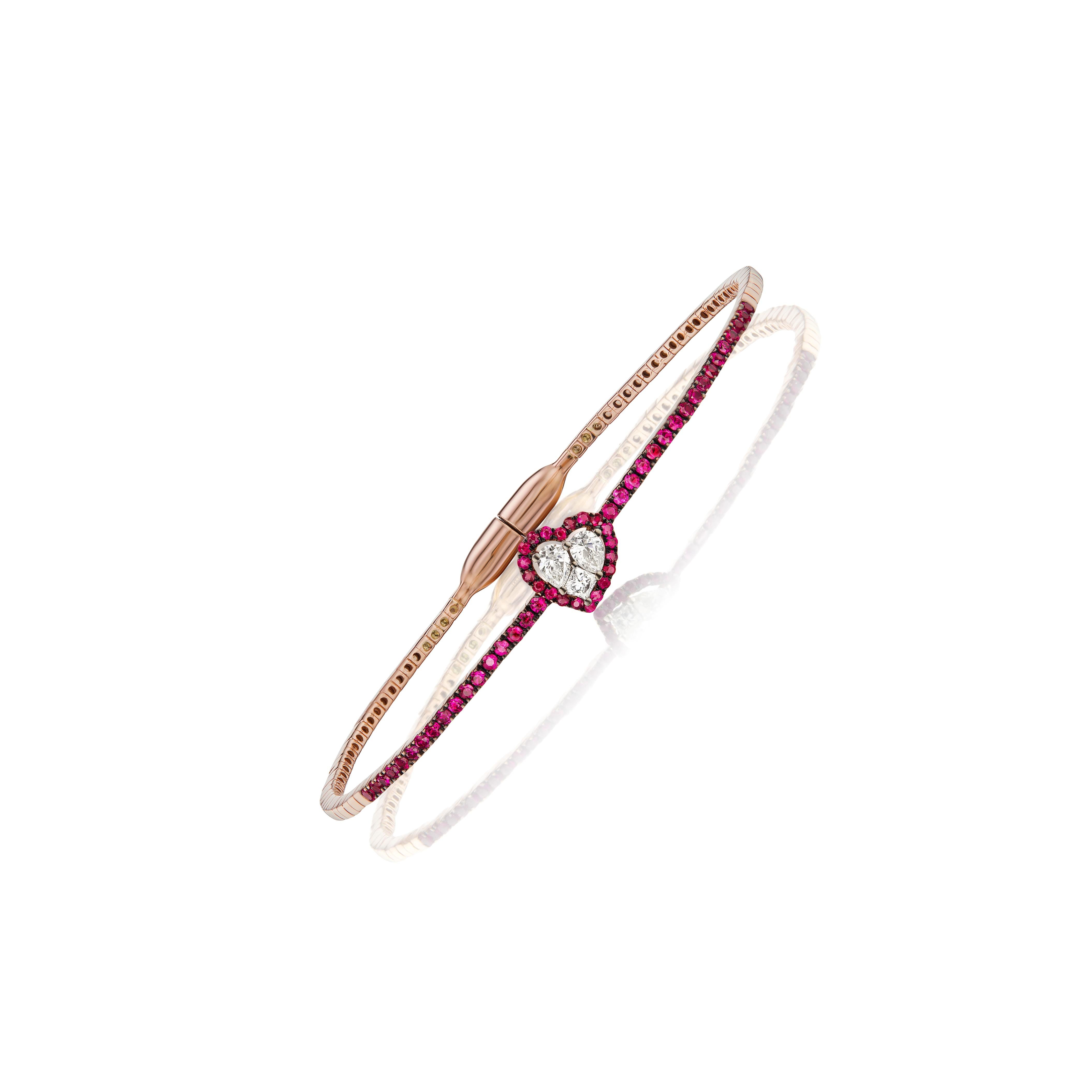 Introducing the Gemistry 1 Cttw. Ruby and Diamond Heart Shape Cluster Bangle in 18k Gold, a stunning symbol of love and commitment. The heart-shaped motif at the center of the bangle is made of a cluster of diamonds and halo of round rubies, adding