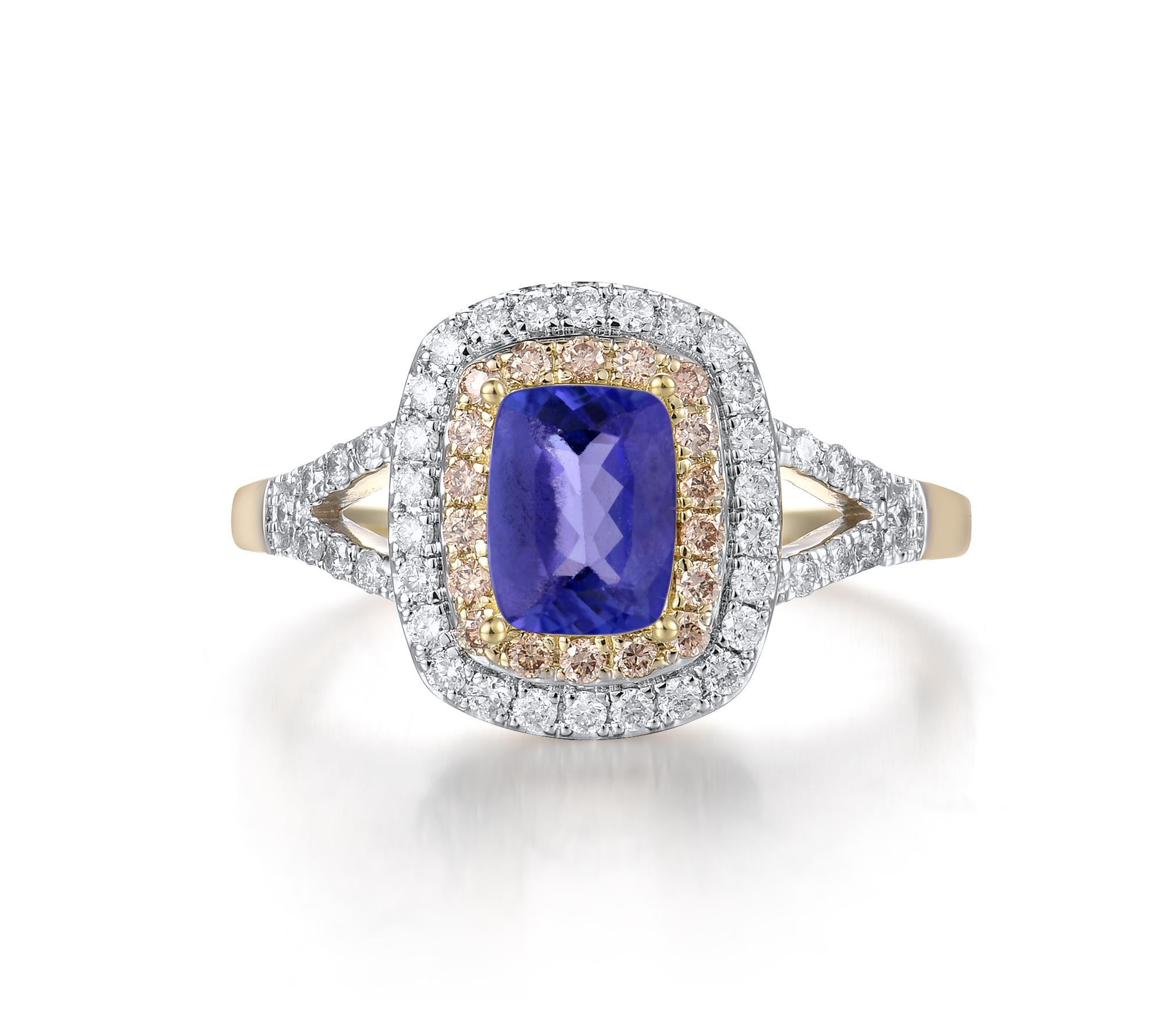 Immerse yourself in the striking beauty of the Tanzanite and Diamond Ring, crafted in luxurious 14K two-tone gold. The ring features a mesmerizing tanzanite center stone, known for its vibrant blue-violet hue, surrounded by a sparkling halo of