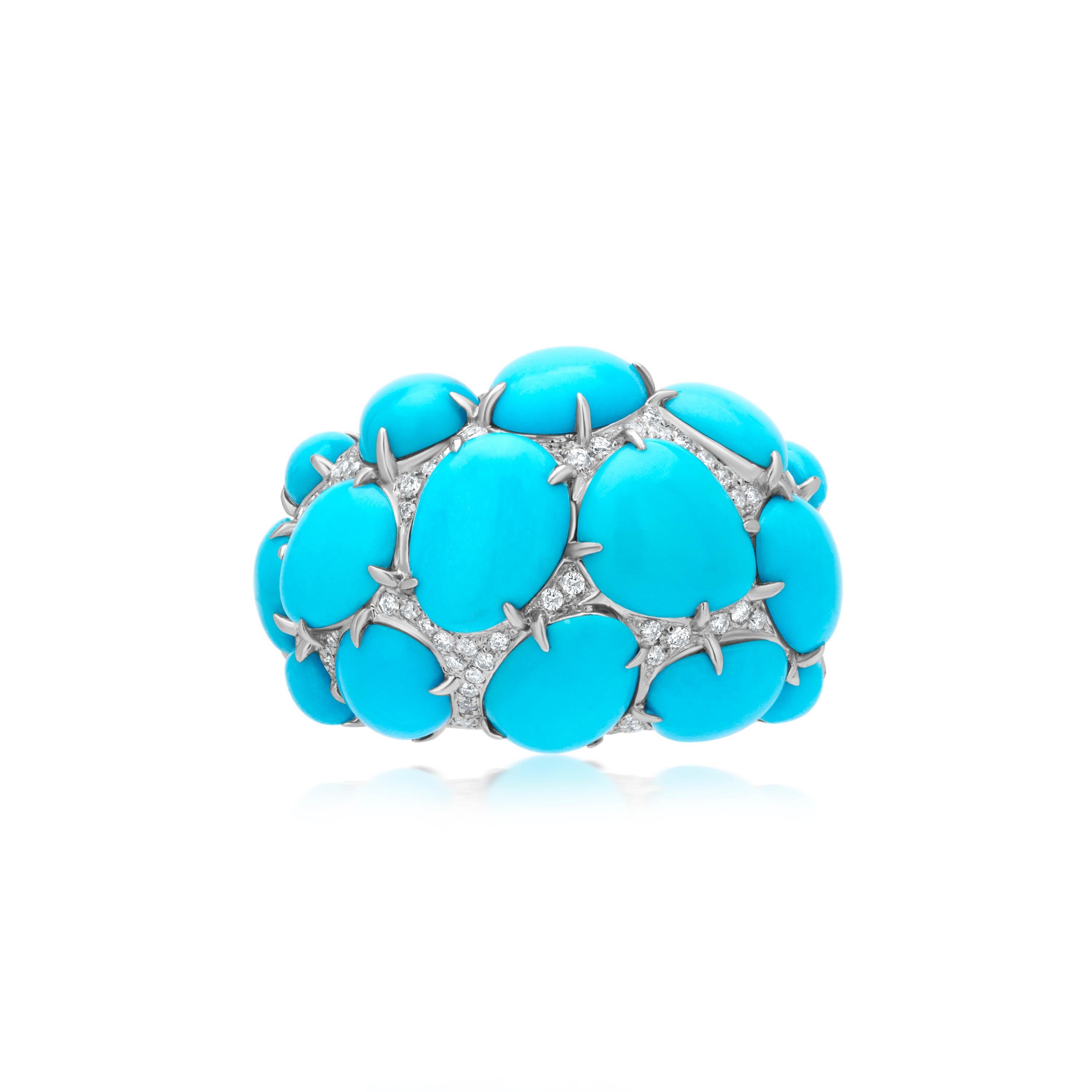 This Gemistry 18K White Gold ring is dotted with twelve pear and oval-cabochon Turquoise stones in a prong setting. The crevices between the blue beauties are filled with round full-cut white diamonds. The diamonds are I1 in clarity and GH in color,