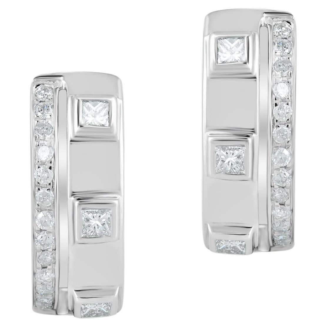 This pair of hoop earrings is made with a total of 0.33 carats of diamonds and set in a 14K white gold. The earrings features a simple design, with a polished finish that is sure to complement any outfit. It is a timeless piece that can be worn