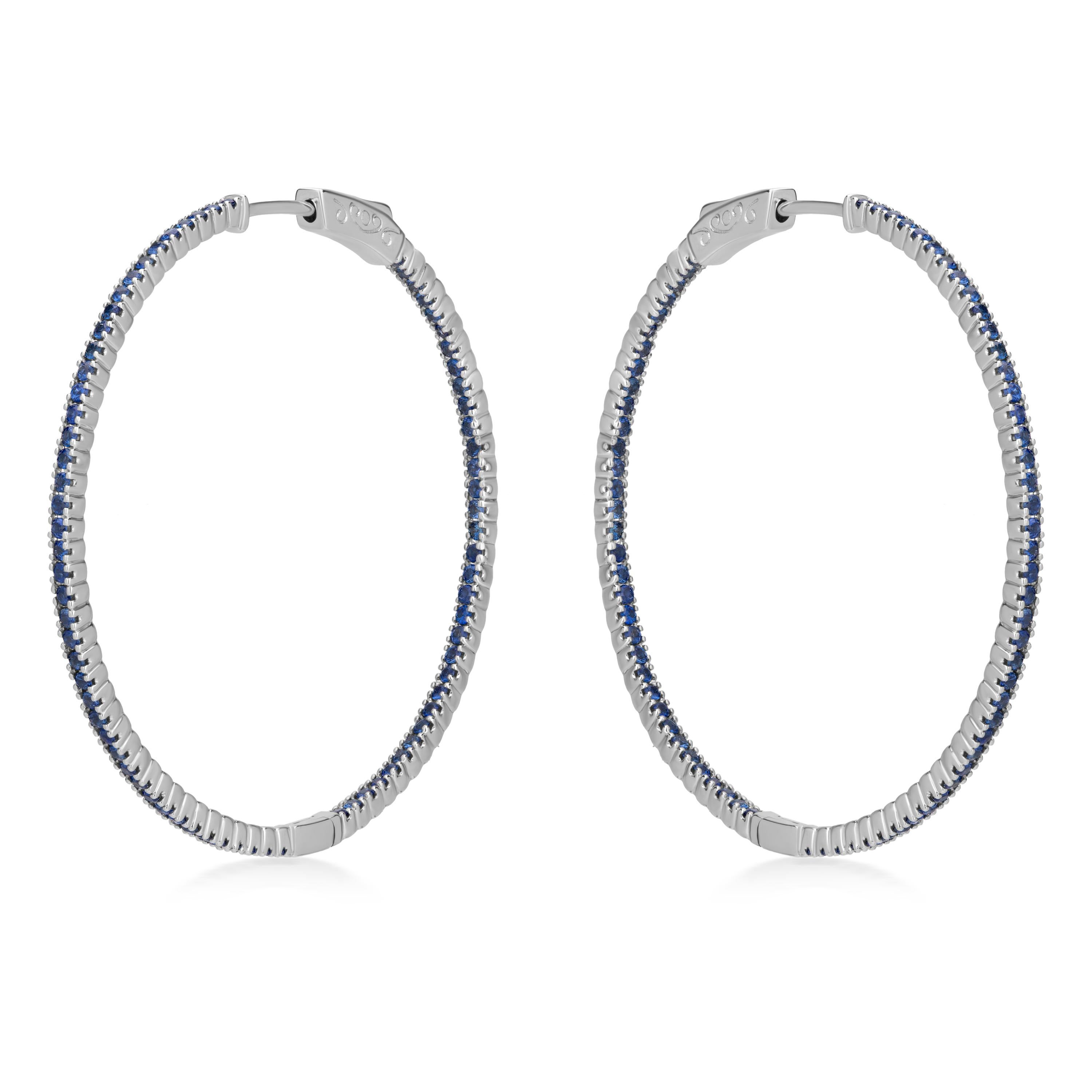 These Gemistry hoop earrings have the distinctive blue glimmer of the sapphire. Gleaming from the inside and outside, 1.52 ct. t.w. blue sapphire rounds illuminate the polished 18k white gold hoops. Hanging length is 1.5”

Please follow the Luxury