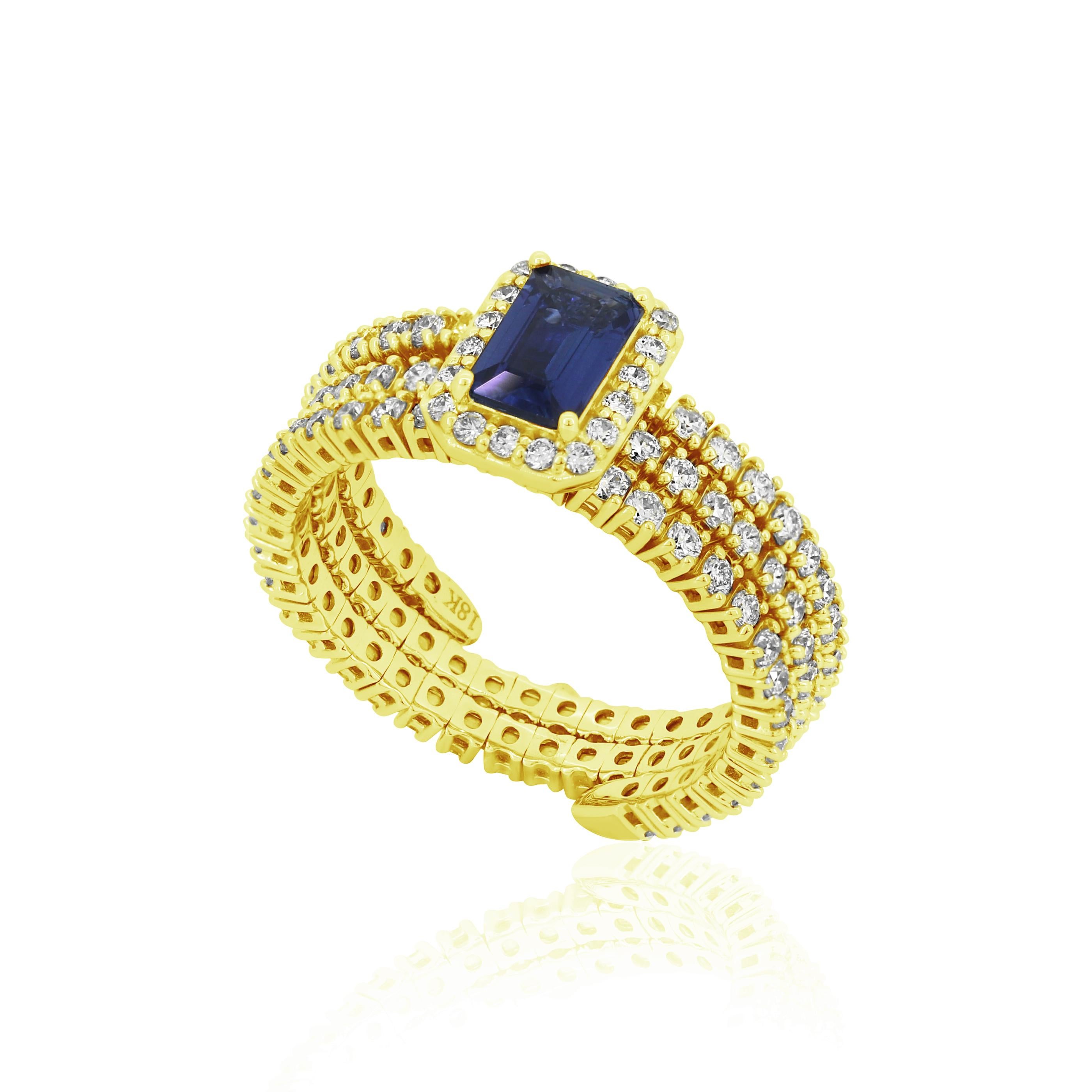 This Gemistry blue sapphire adjustable ring in 18 Karat yellow gold with diamond displays alluring hues and a lot of sparkle. The ring's magnificent octagonal cut blue sapphire is set in the center, and a diamond halo surrounds it. Round white