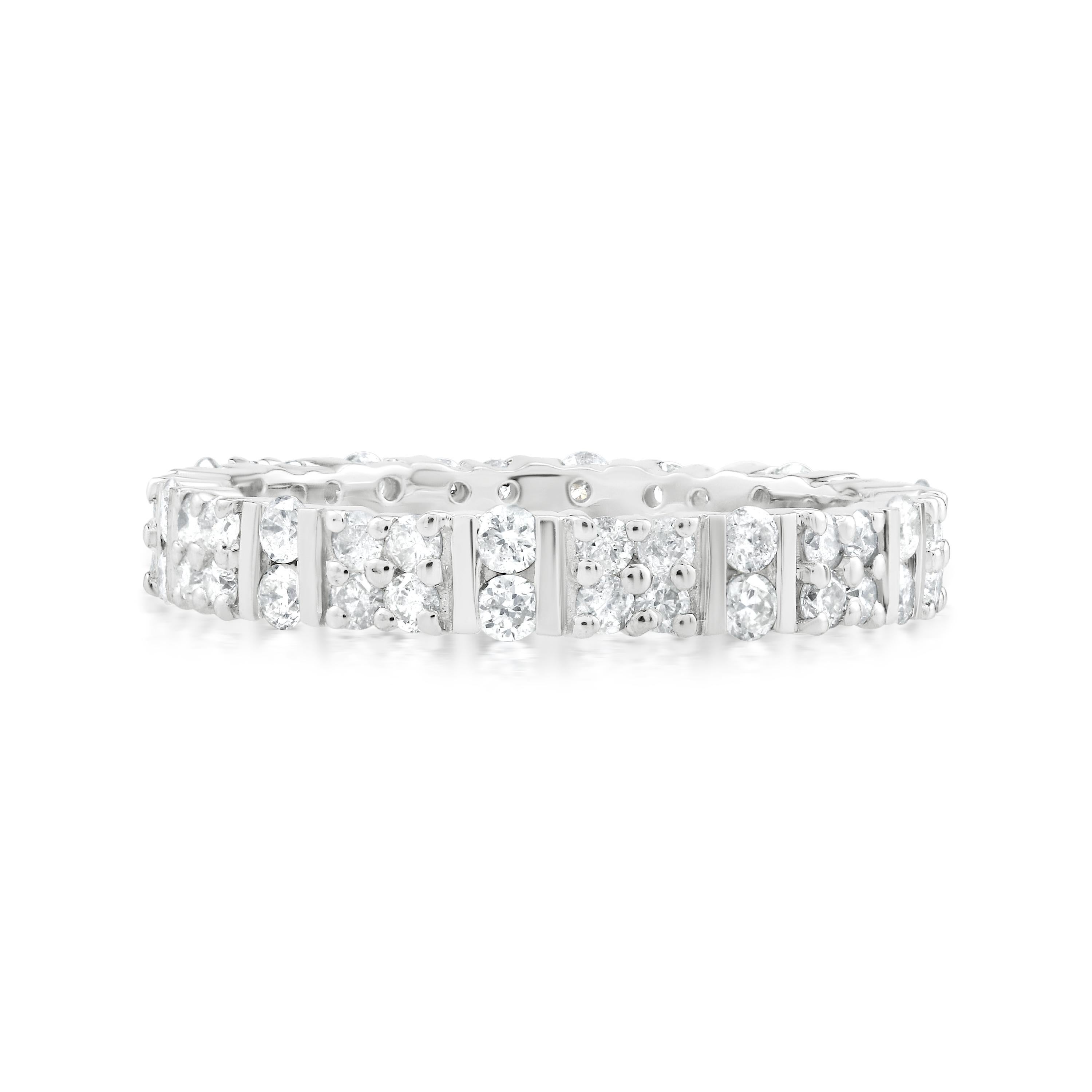 Sparkle from every angle with this timeless diamond eternity ring by Gemistry ! 1 ct. t.w. of round and full cut diamonds are prong and pave set in a channel of polished sterling silver. The diamonds are of GH color and I2 clarity.
Please follow the