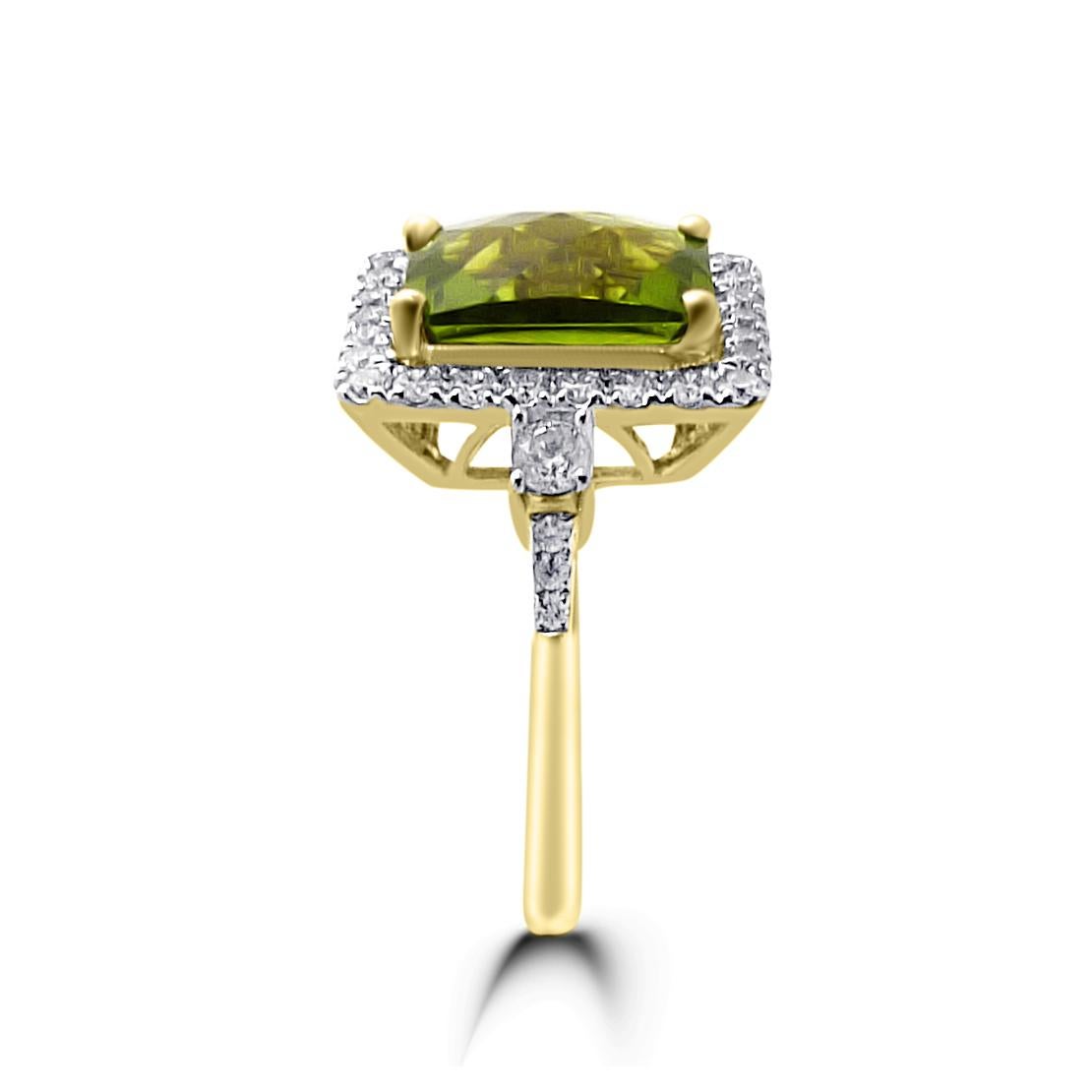 Illuminate your finger with the Green Manchurian Peridot and Diamond Ring in 14K Two-Tone Gold. This stunning piece features a vibrant emerald-cut peridot center stone, showcasing its captivating green hue, surrounded by a sparkling halo of full-cut