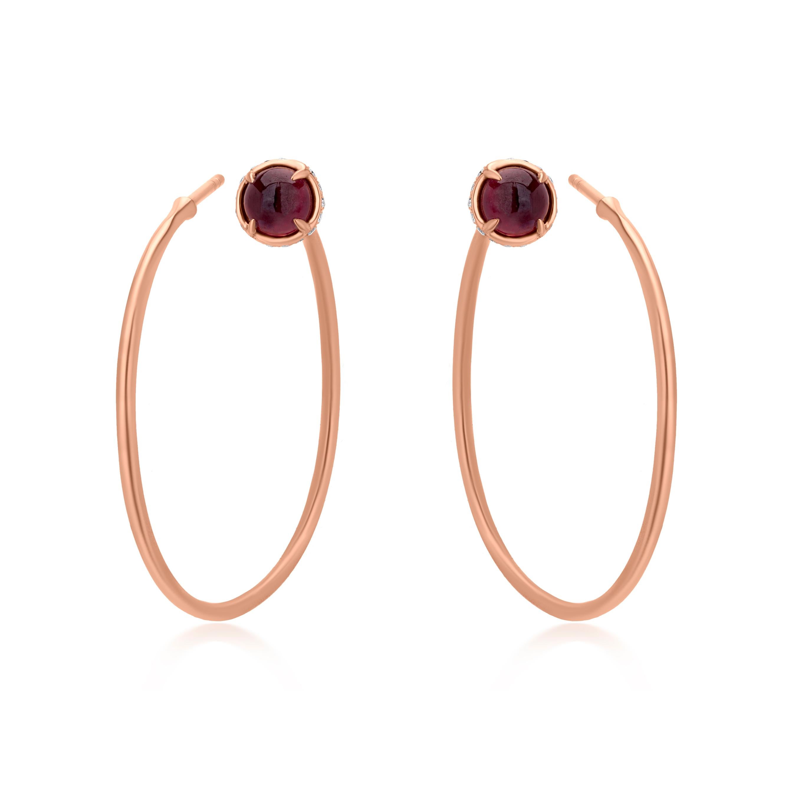 A sleek V-style shaped hoop Post & clutch 18K Rose Gold earring pair have a round-cabochon Ruby stones on the part of each piece that will sit on the earlobe. Set in a prong, the Ruby stones are well-complemented by round full-cut Diamonds in a