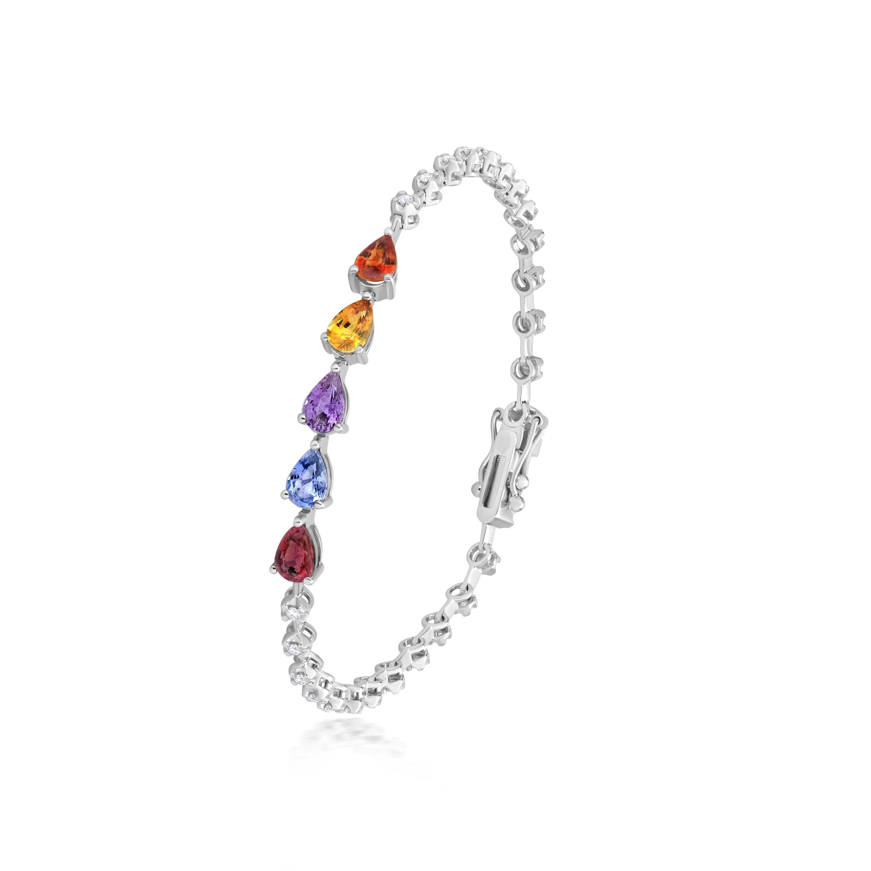 Truly bright and festive, this Gemistry multi sapphire and diamond station link bracelet features five pears of 2.4 Cts. multi sapphires at the front in prong setting. The other half of the bracelet is enclosed with round brilliant 0.39Cts. diamonds