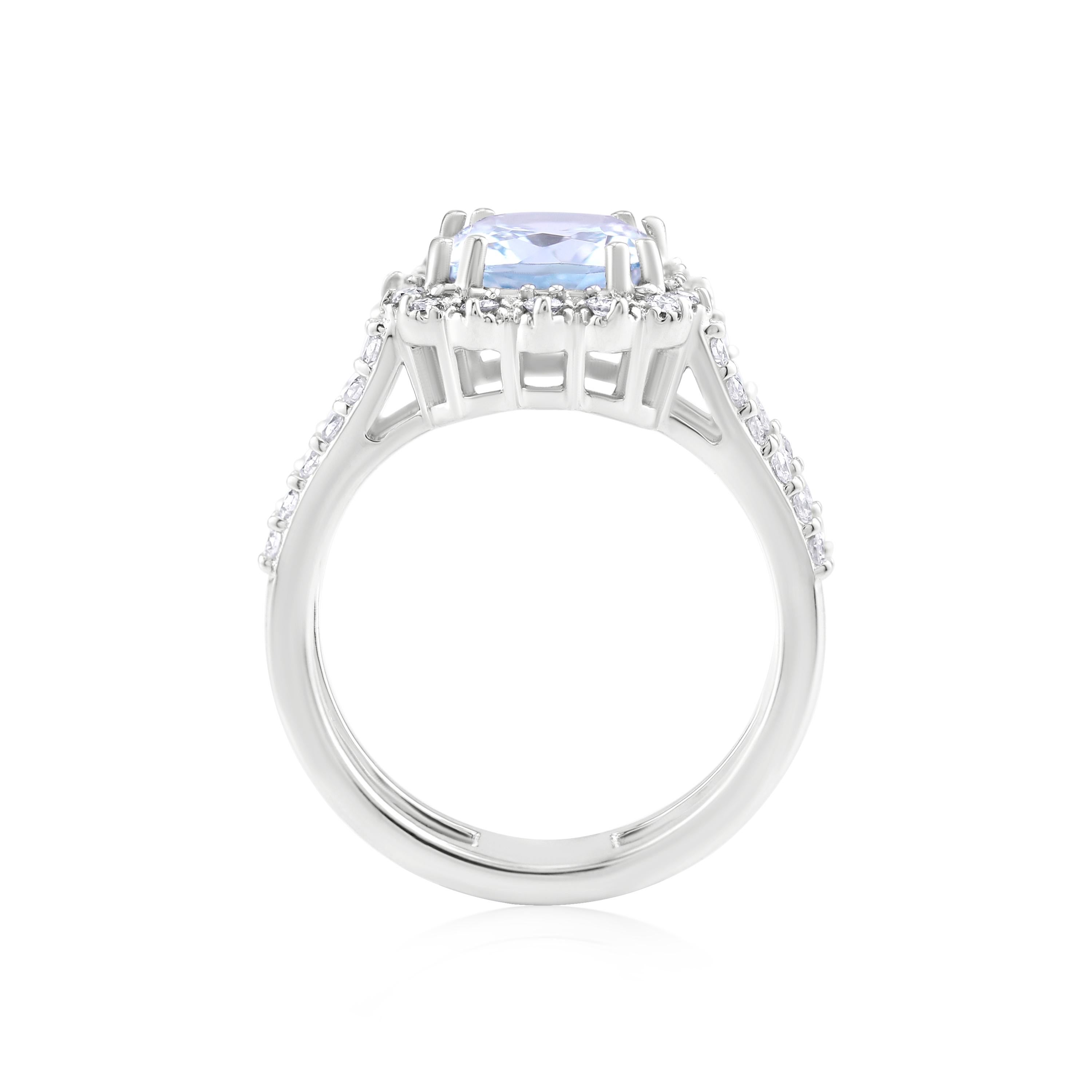 Known to inspire calm energy , aquamarine adds serene beauty to any look. The ring features a 2.66 carat cushion cut aquamarine illuminated by .58 ct. t.w. round brilliant cut diamonds in 14k white gold. Diamond split ring shank ring by Gemistry.