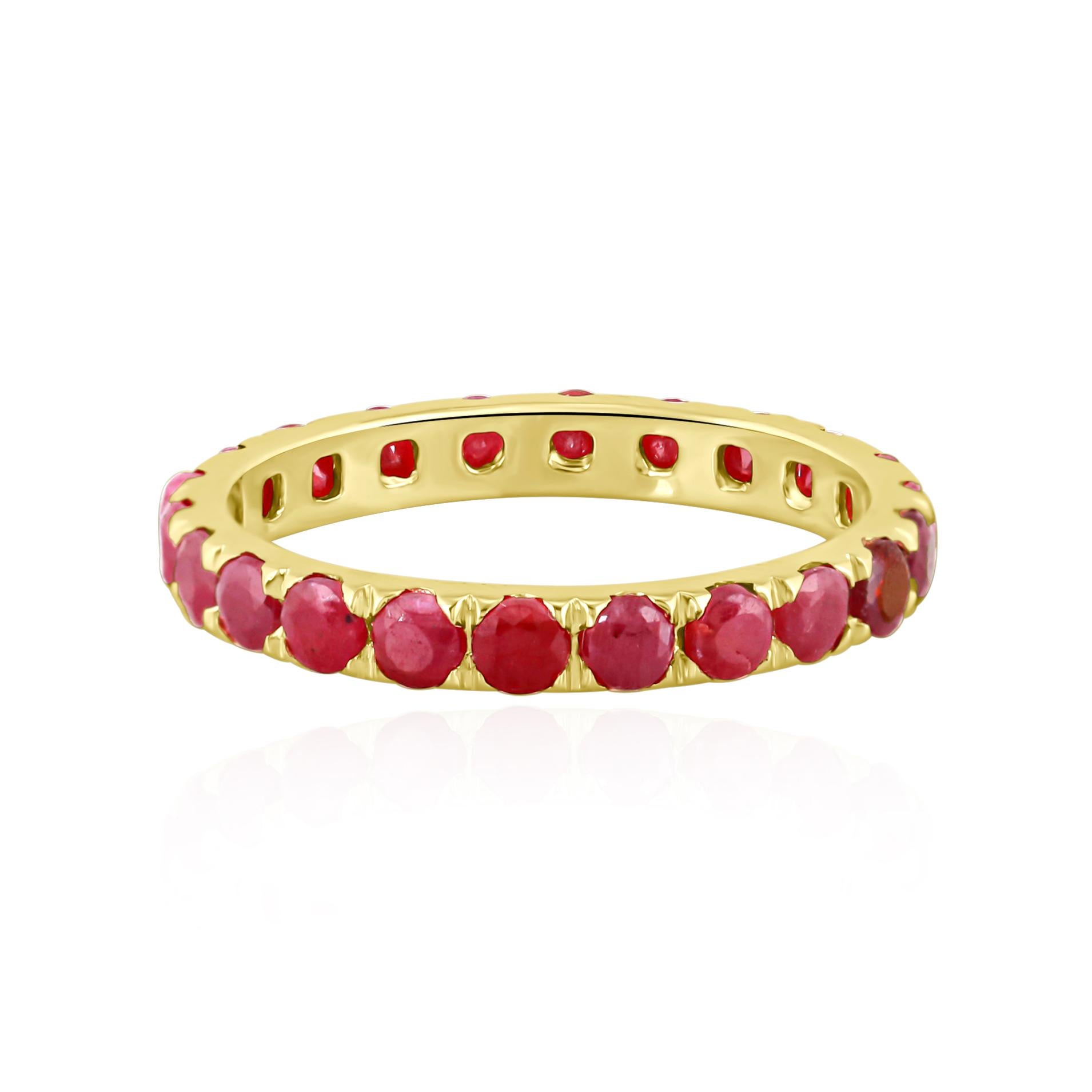 This 14K Gold full eternity ruby ring features a timeless and classic design, showcasing a continuous row of sparkling rubies that create a dazzling and luxurious effect. The round-cut rubies are expertly pave set perfectly complemented by 14K gold