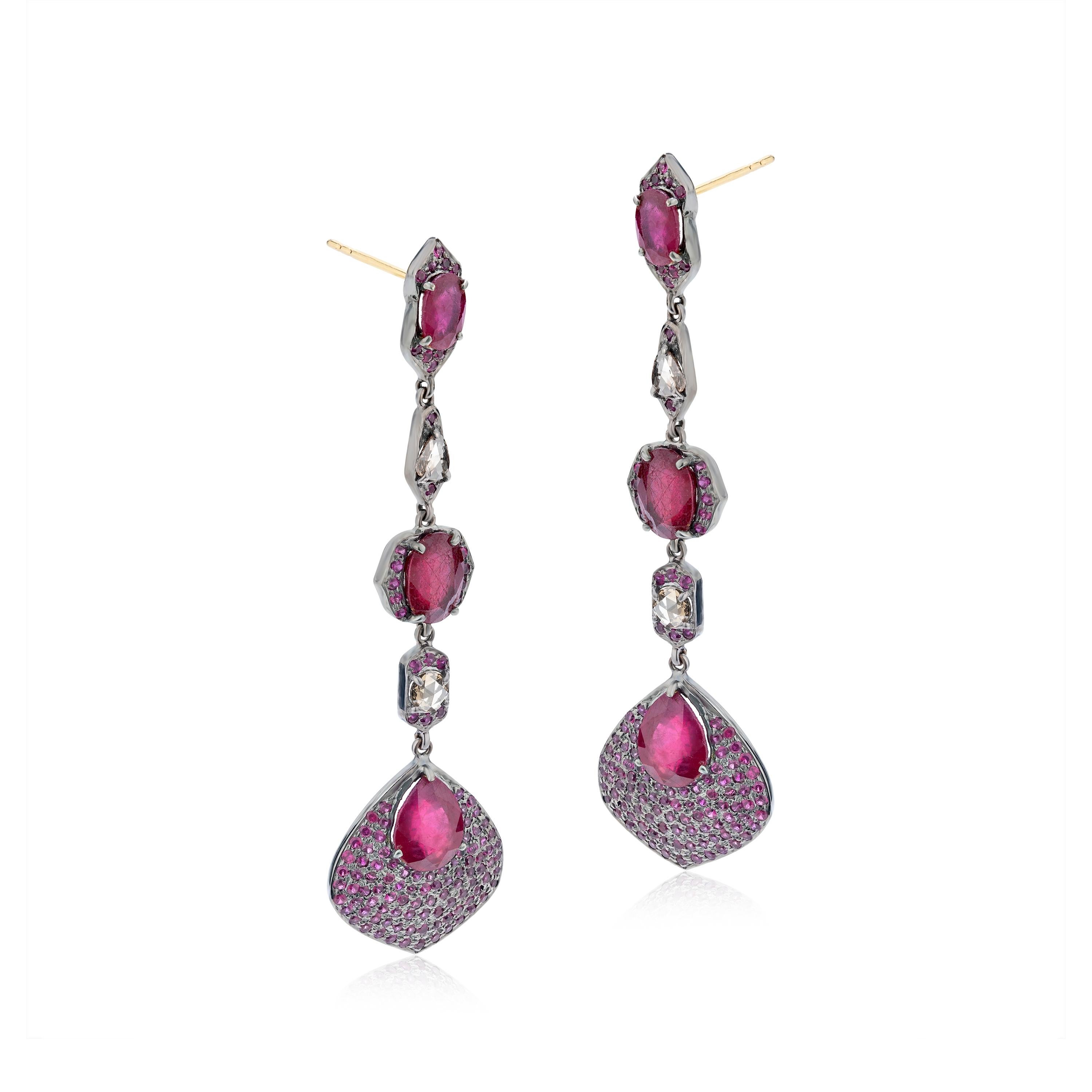 This Gemistry, Victorian 12.74 Ct. T.W Ruby and Diamond Drop Earrings features round and pear ruby and diamonds alternating on 18K/925 polished surface .  Round ruby studded leaf drops completes this mesmerizing piece. The classy earpieces are
