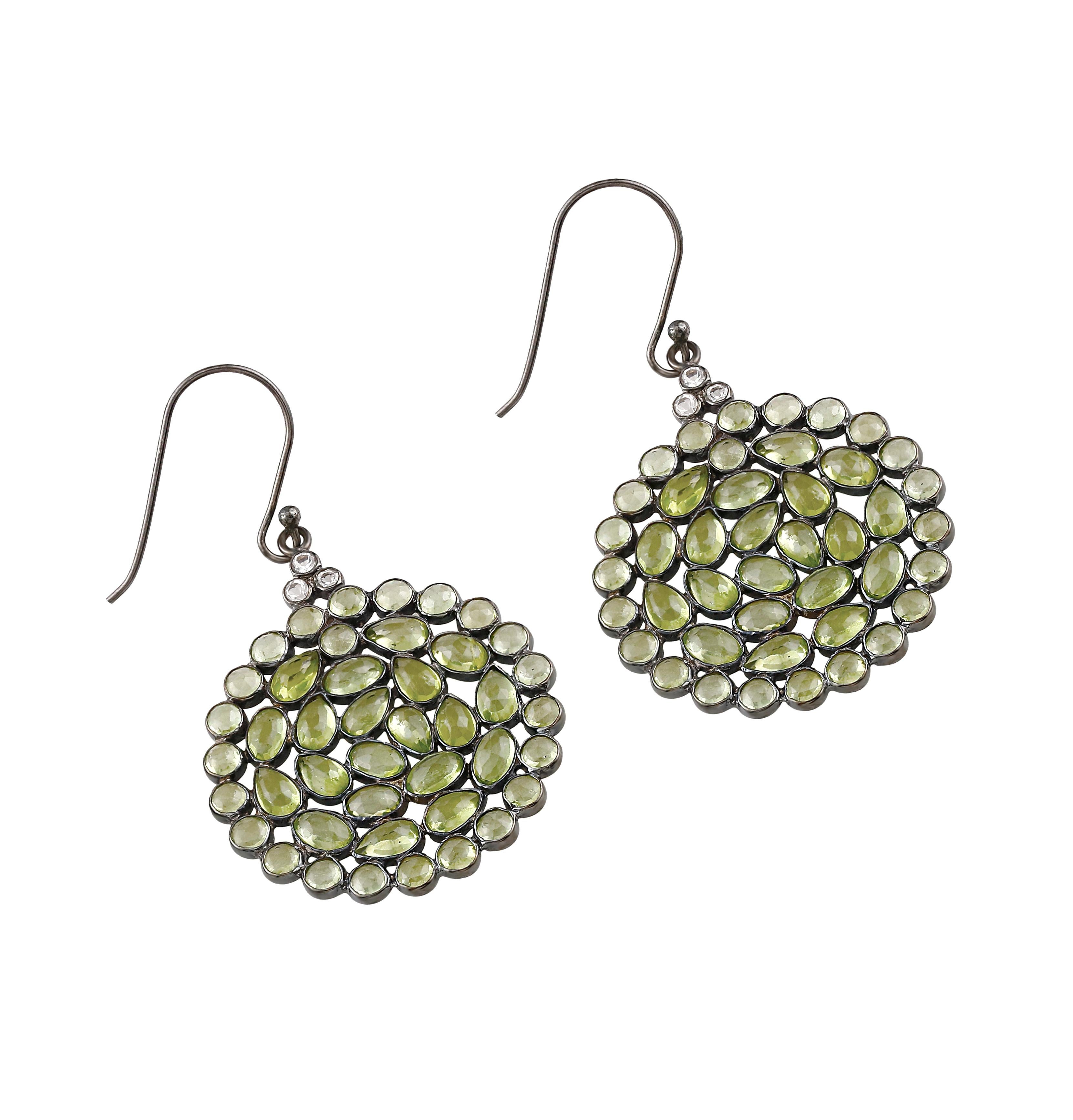 You will definitely love the sparkling hues of these Gemistry Victorian handcrafted sterling silver drops! The classic circular design showcases vibrant peridots accentuated with topazes dangling from lever backs. Pair these with the matching