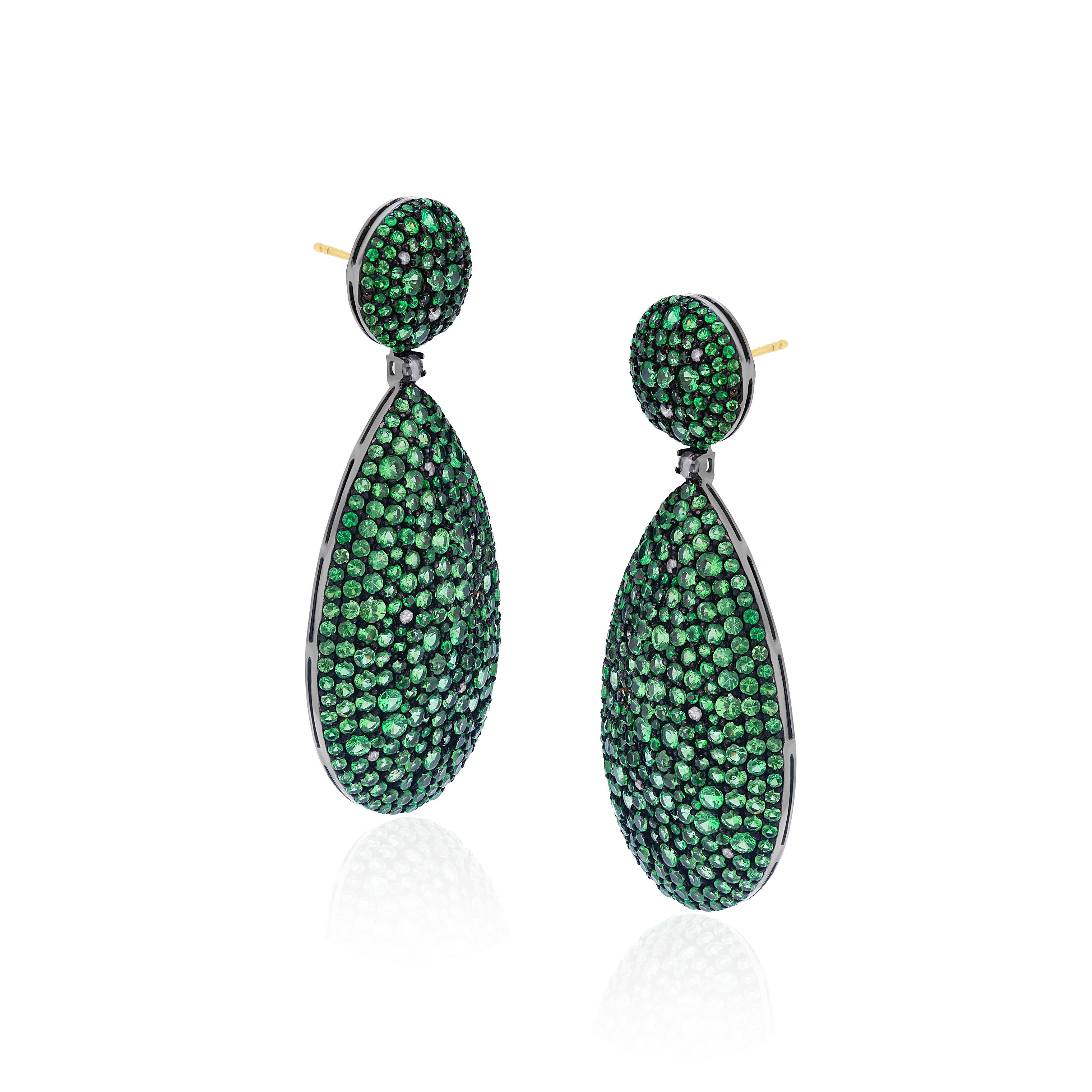 Make a statement with these Gemistry Victorian drop earrings in 18K White Gold & Black Rhodium Silver, inspired by the glitch and glam these pave pear drops of Tsavorite greens accentuated by diamonds sway with glamour from round surmounts of