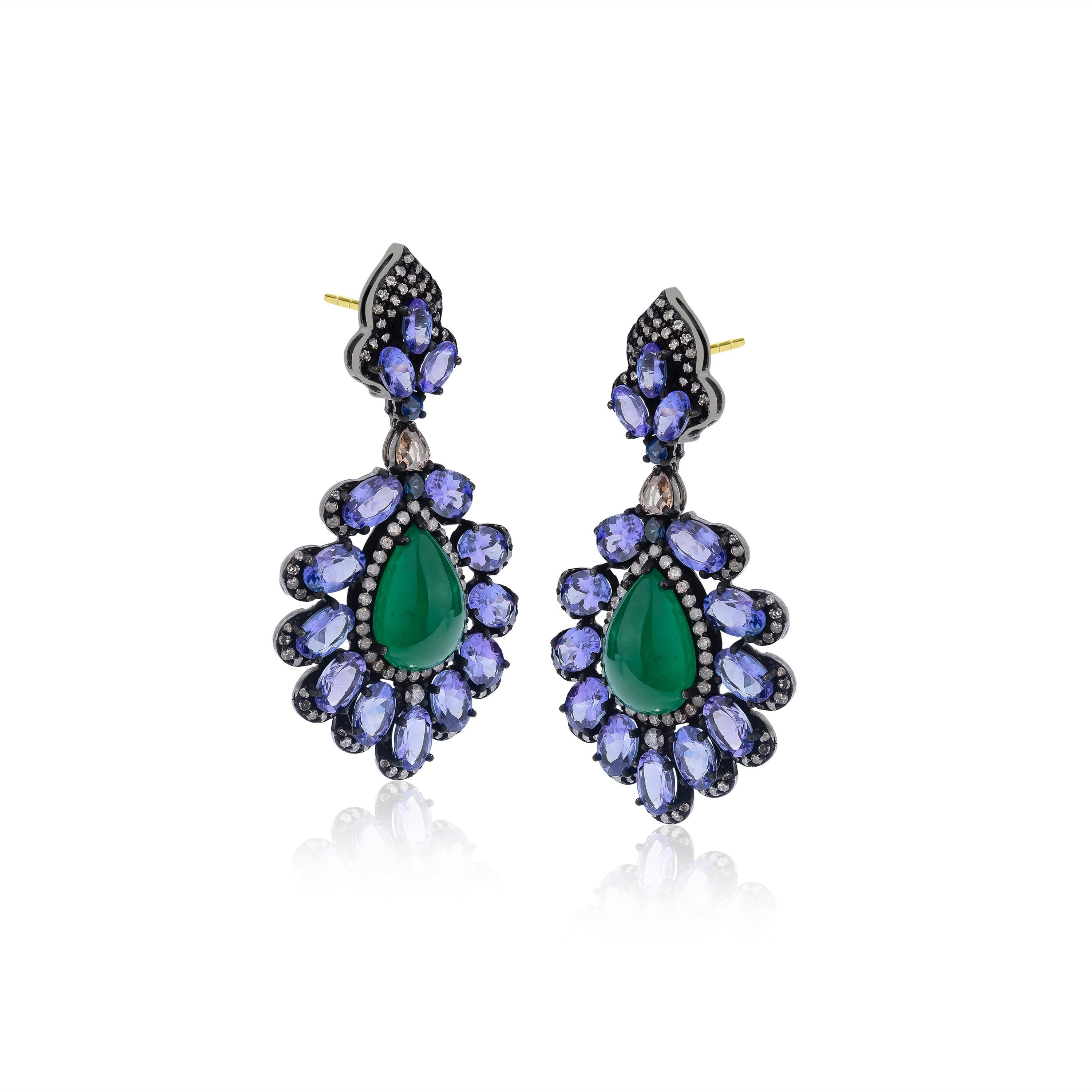 Fun and flirty, these Gemistry Victorian drop earrings glow at their centers with pear cut emeralds that are framed inside exquisitely designed frames of faceted tanzanites and diamonds. Rendered in 18K gold and 925 sterling silver these stunning