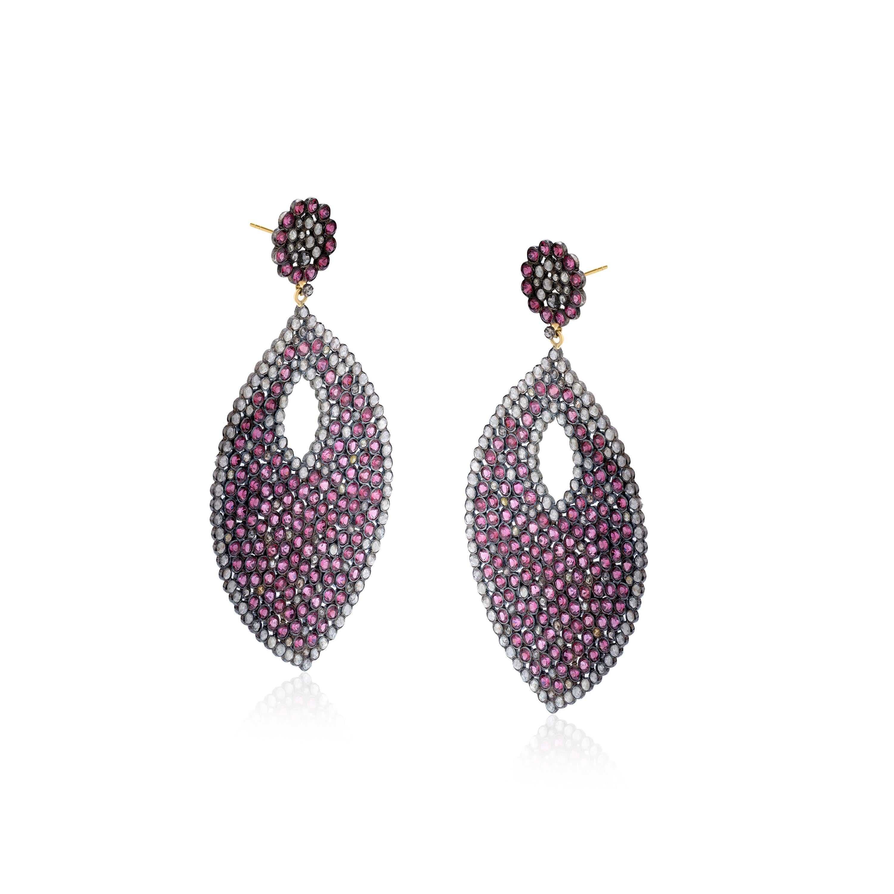 This Gemistry, classic drop earrings in leafy shape are manifested in 18K/925 White, Yellow & Black Rhodium Sterling Silver. The earrings are well decorated with diamonds, weighing 6.78 Cts. Sparkling pink tourmaline stones glam up the silver body.