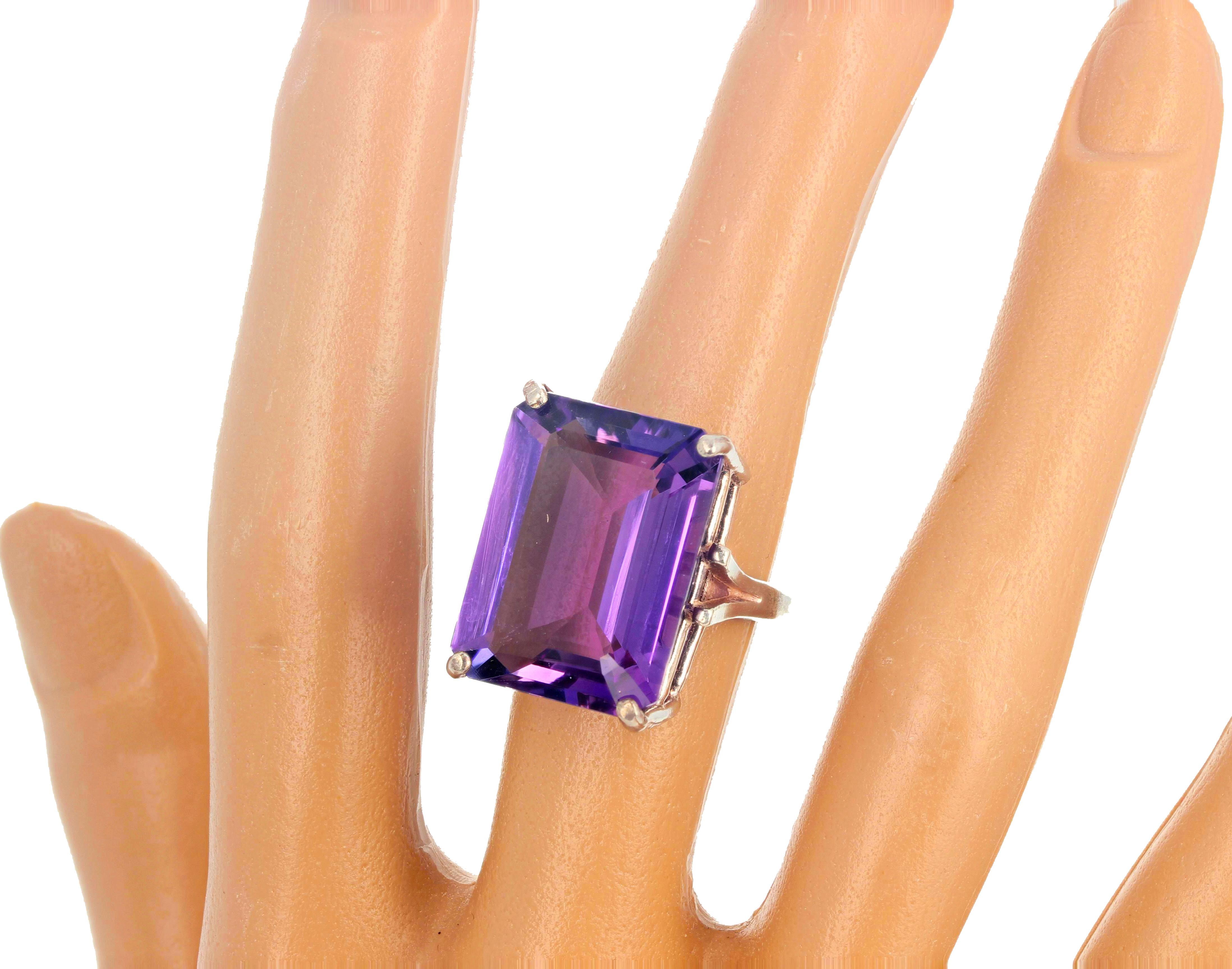 Simply elegant cocktail solitaire purplepink cushion cut solitaire 12.6 carat Amethyst (20 mm x 15 mm approximately).  There are no eye visible inclusions in this gorgeous gemstone that sits up high on the finger in this sterling silver ring size 7