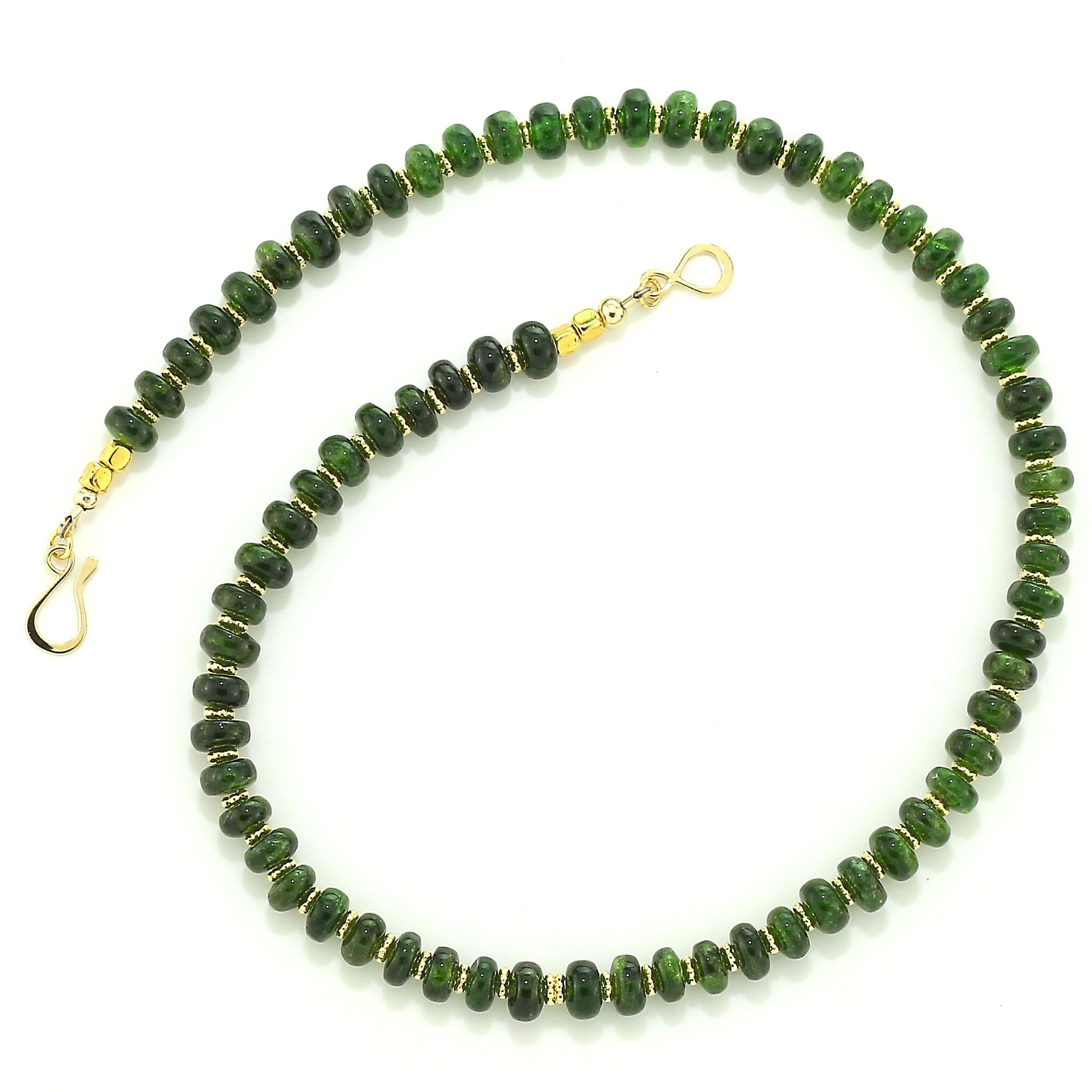 Unique deep green Chrome Diopside ﻿17 inch necklace with goldy daisy accents and 14K gold vermeil hook and eye clasp. This lovely translucent Chrome Diopside is 8 MM rondelles which are highly polished on the entire surface.  The rich gold tone