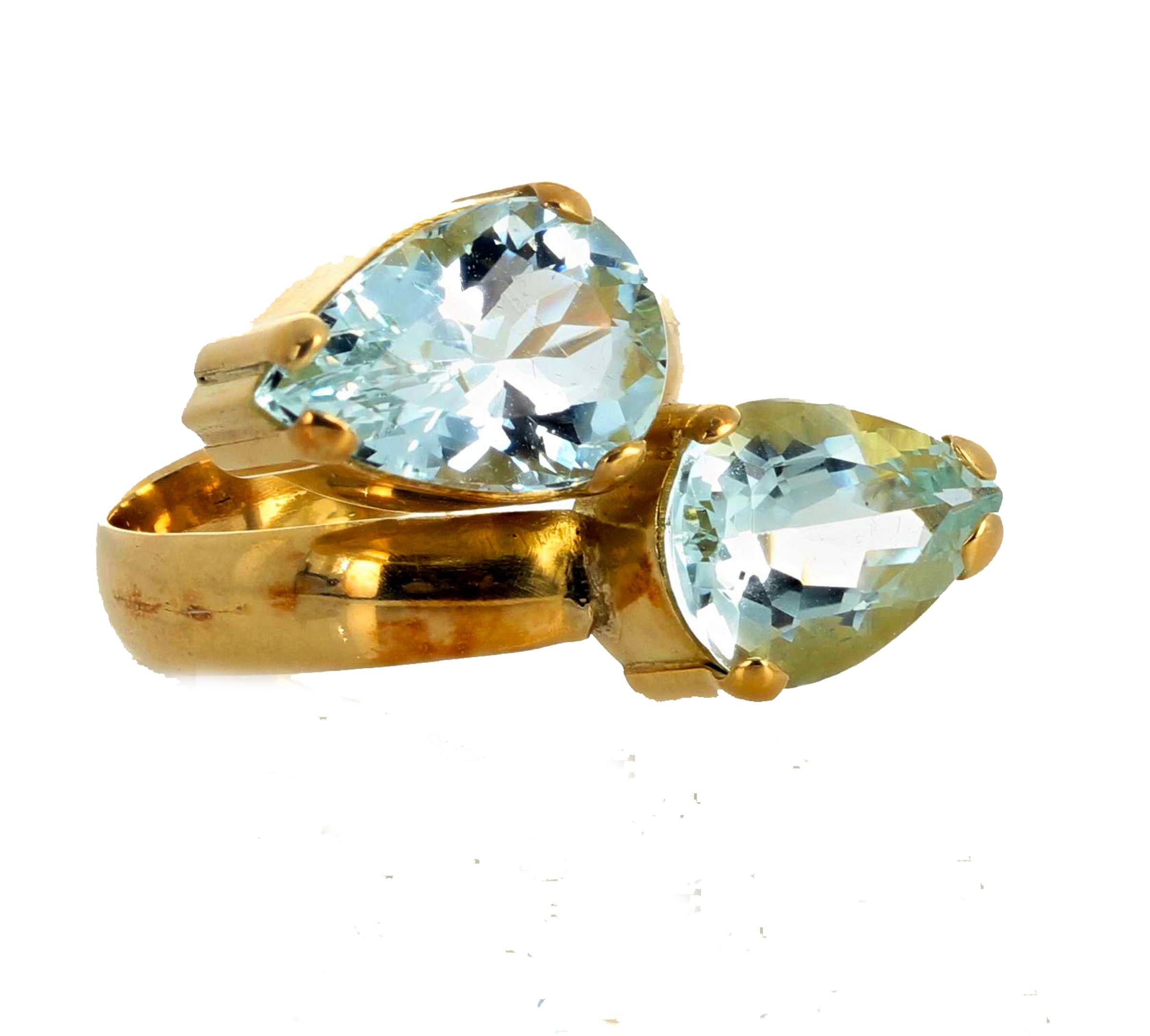 These spectacular silvery blue natural 6 carat Aquamarines are clear with no eye visible inclusions.  The beautiful handmade 18Kt yellow gold setting is a size 7.5 sizable by just pulling apart or squeezing together - you can do it yourself -  and