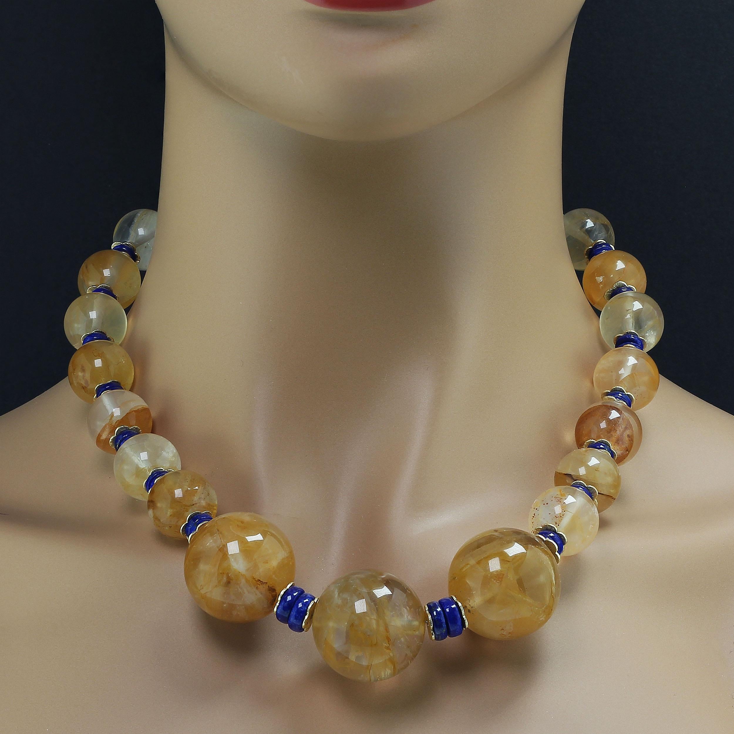 Elegant 20 inch Golden Quartz and Lapis Lazuli necklace. Three focals of 25 MM each grace the front of this unique necklace. They are accented with 10 MM highly polished Lapis Lazuli rondelles. 15 MM Golden Quartz and 8 MM Lapis Lazuli are featured