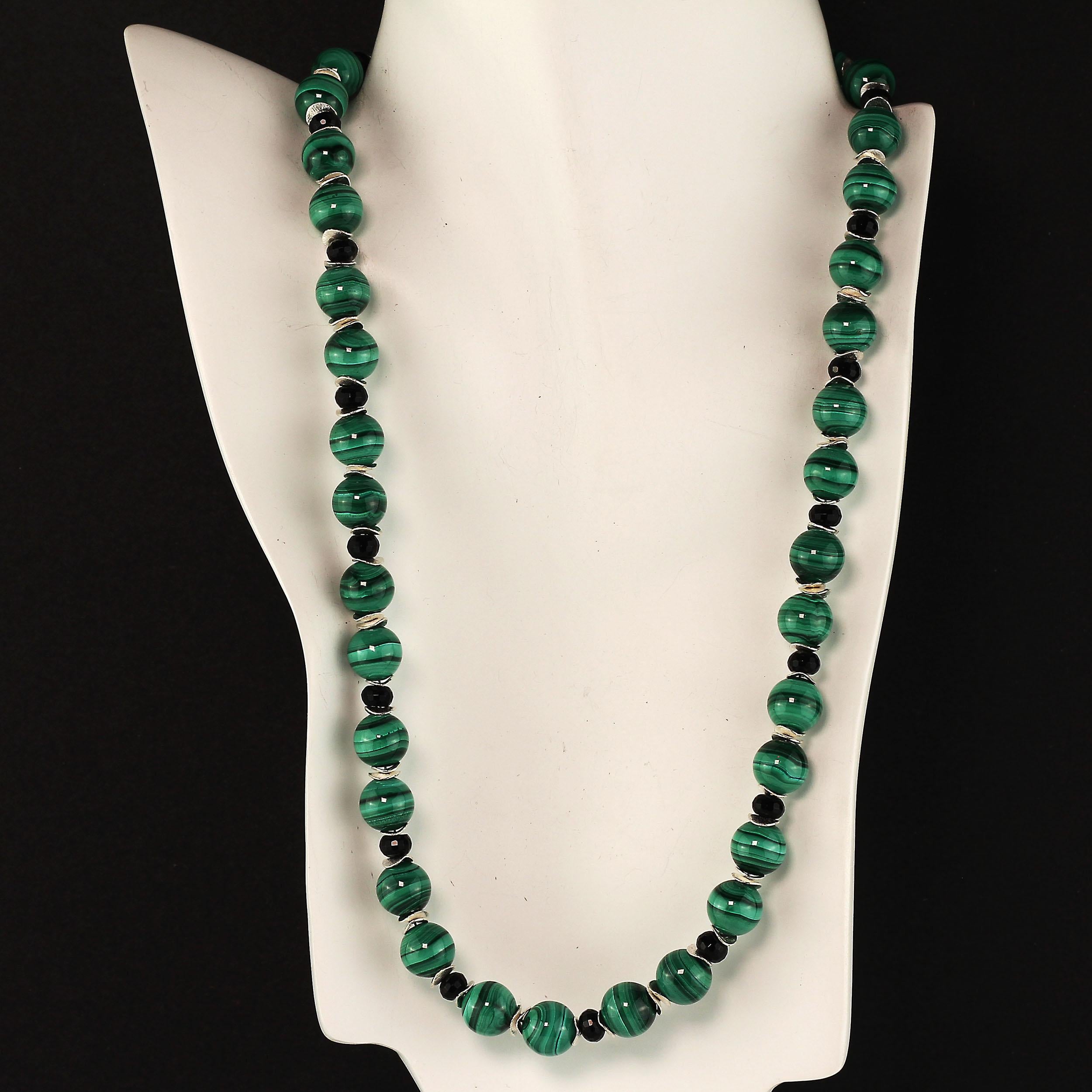 Love that green! Malachite is such a great green and banded with black.  This 21.5 inch necklace features 10 MM highly polished smooth Malachite and 6 MM faceted Black Onyx. These gemstones are enhanced with silver tone flutters and finished with a