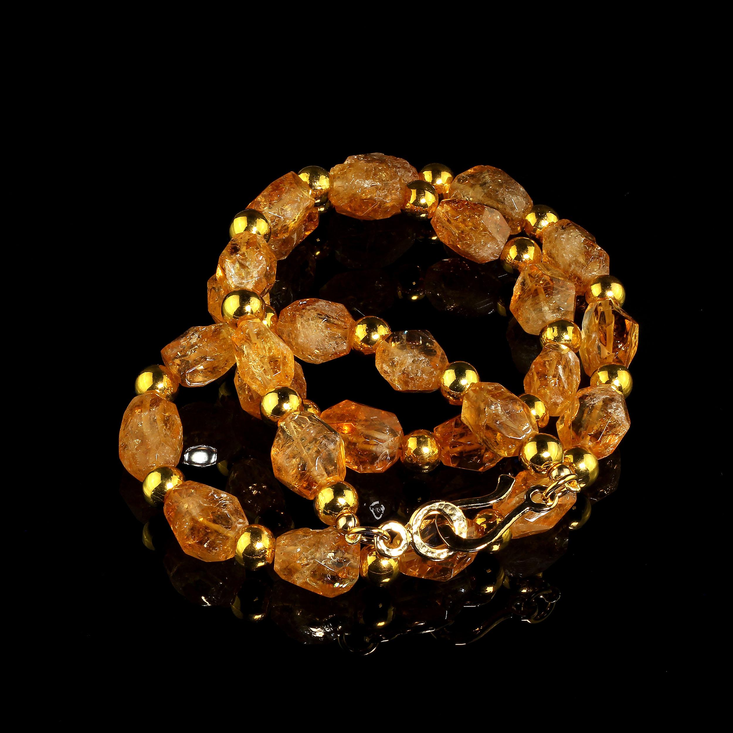Fun and funky necklace of gorgeous golden faceted nuggets of Citrine with glistening goldy accents. These nuggets, which vary from transparent to translucent, are roughly faceted in approximately 14 X 11 MM pieces spaced with 8 MM accents. This