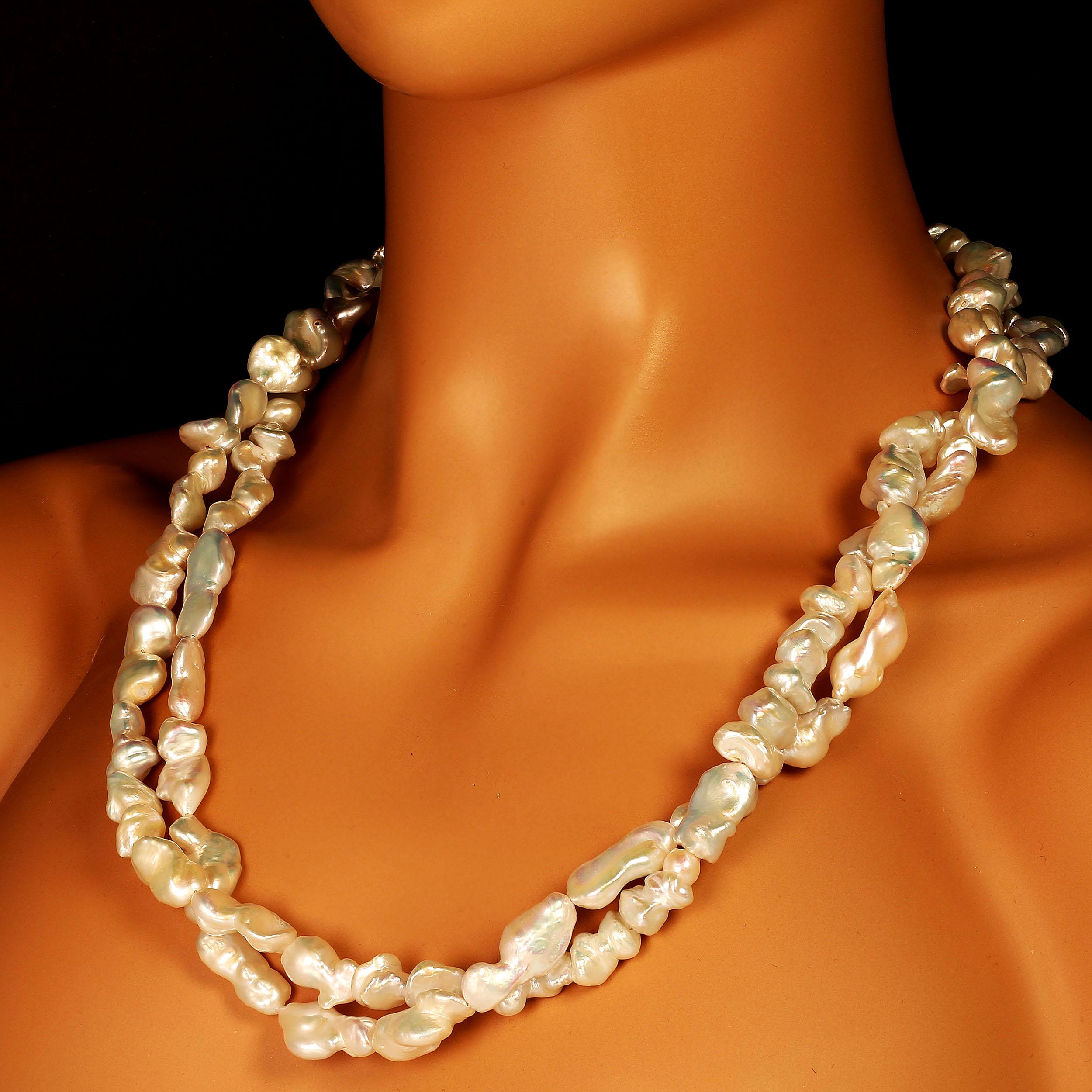 'Pearls are always appropriate'   Jackie Kennedy

Custom made necklace of Iridescent Silvery White Baroque Pearls with a Baroque Pearl Clasp. The entire necklace is 62 inches in length which makes it very versatile: You can wear it as One long