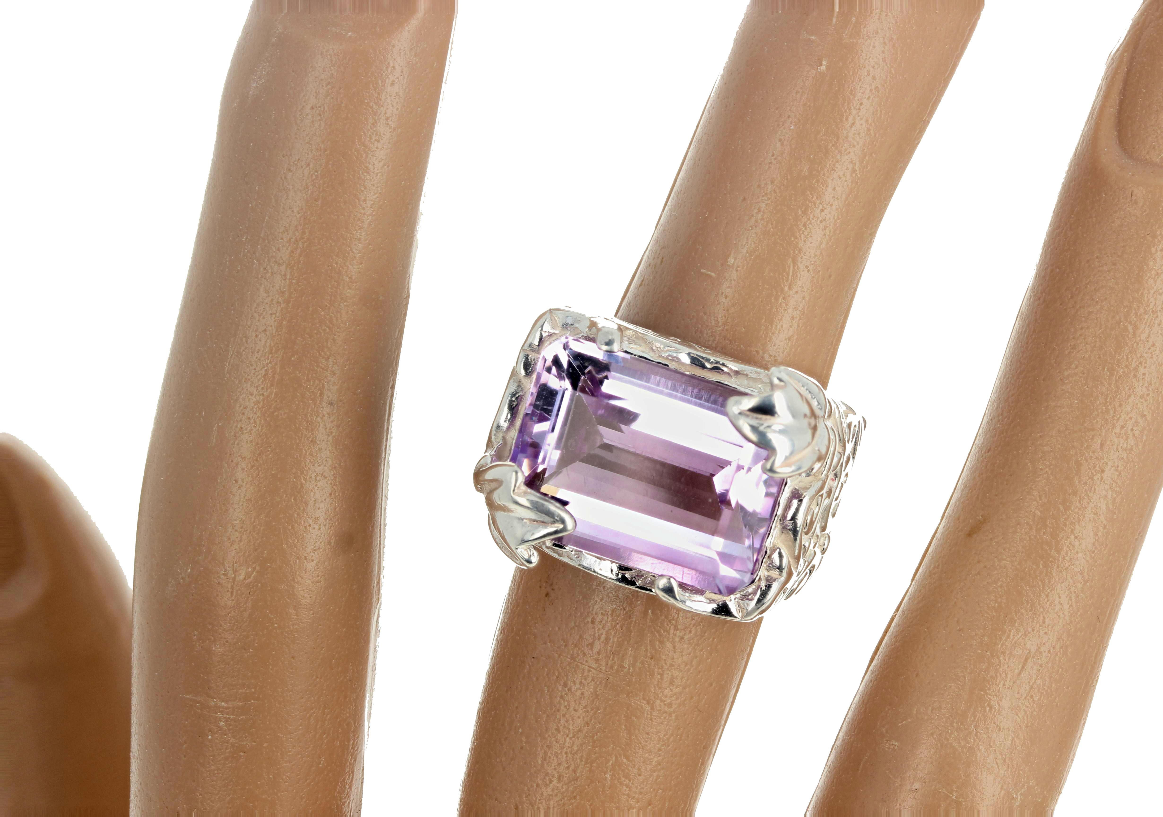 This lovely 6.5 Carat Amethyst ( 16mm x 12mm) has a lovely pinky flashing color in it with NO eye visilble inclusions.  The Sterling Silver setting is elegant and exaggerates the beauty of the gemstone.  It is a size 7 sizable.  If you wish faster
