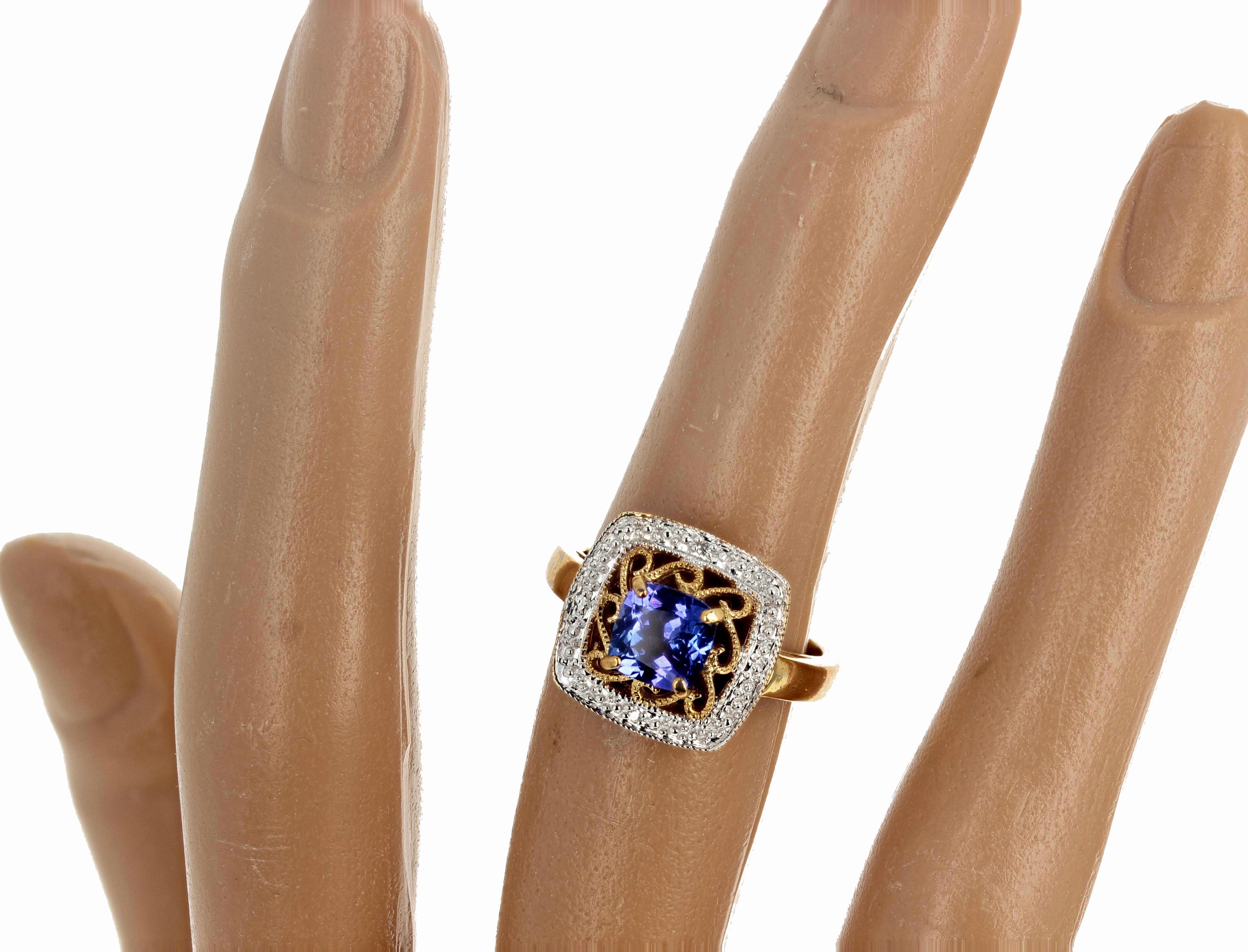 Glittering brilliant square cushion cut 1.35 carat blue Tanzanite (6.1mm x 6.1mm) enhanced with tiny white Diamonds set in an elegant 10K yellow gold ring size 7 (sizable for free).  This is really a very beautiful ring that will go to weddings,