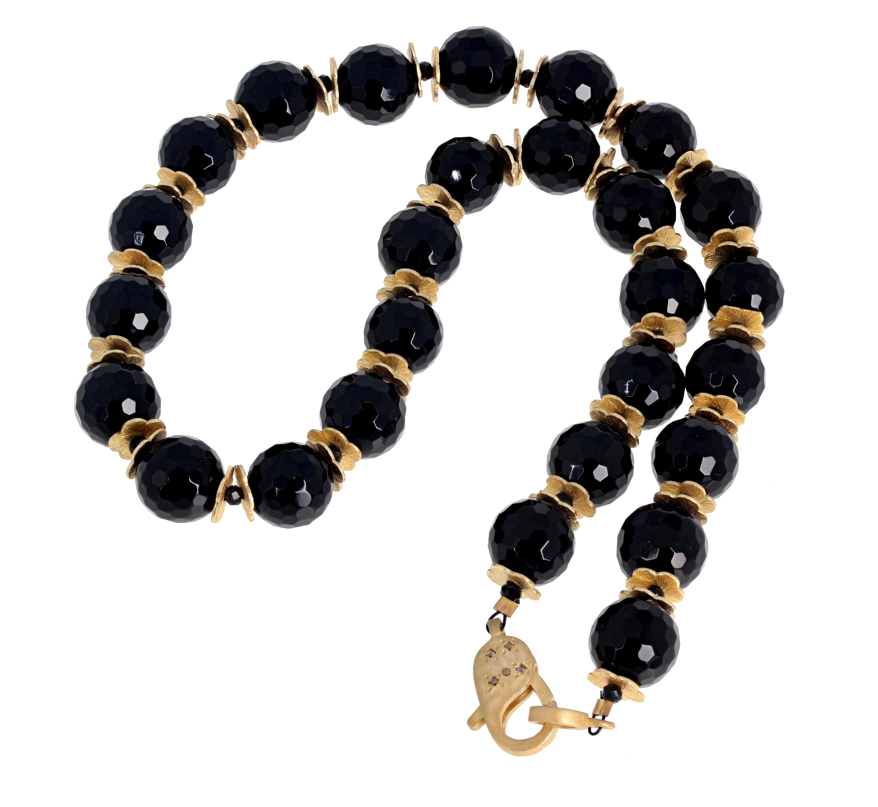 Superbly elegant 12.5mm glittering natural Black Onyx are enhanced with sparkling tiny little black Spinel between the gold plated rondels in the 17 1/2 inch long necklace.  The clasp is gold plated sterling silver encrusted with tiny little real
