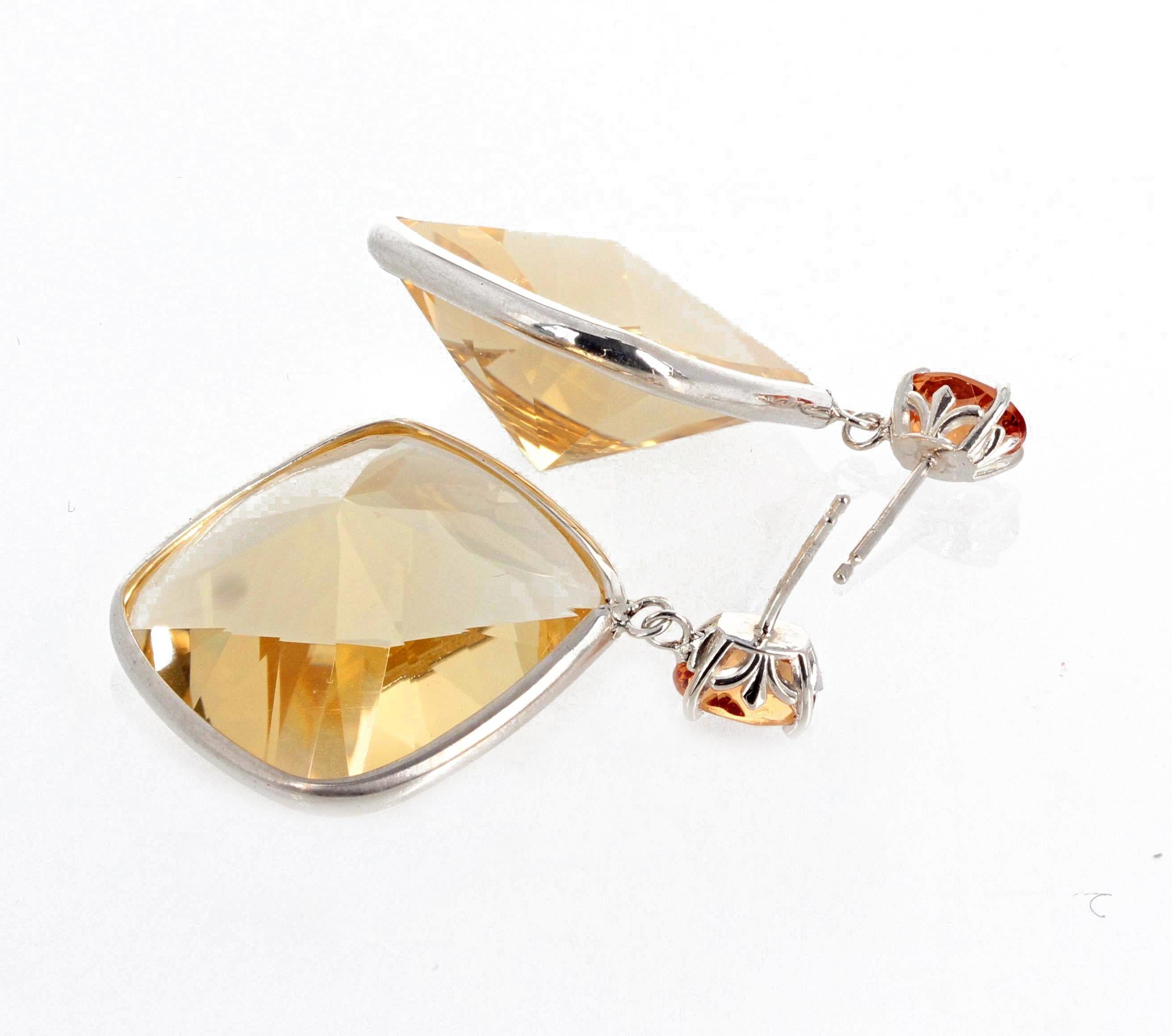 The brilliant smaller Citrine gemstone on top are 0.66 carats each ( 7.2mm x 5.2mm) and the large glittering lighter Citrines all set in sterling silver are 26 carats each (20mm x 20mm).  These gemstones are cut so as to glitter brilliantly in all