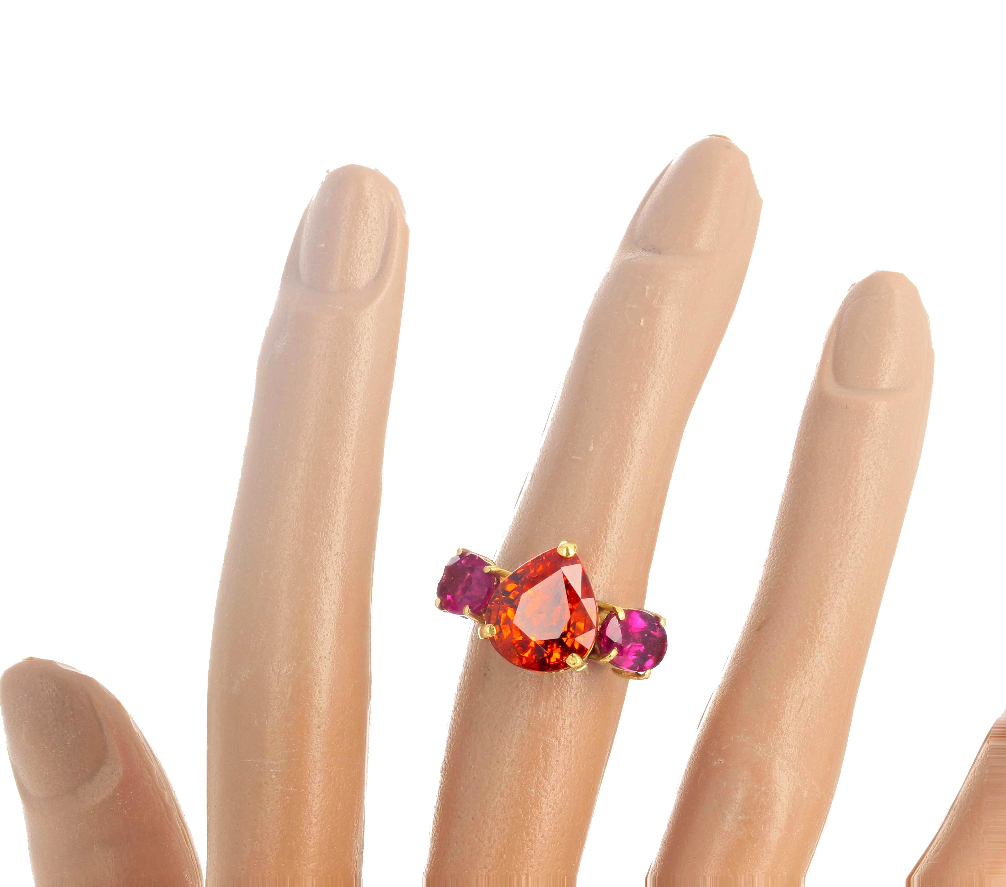 Glittering brilliant natural RARE 7.62 carat Spessartite Garnet (11 mm x 10.4 mm) enhanced with natural glowing pinkyred oval Tourmalines (8 mm x 6 mm) set in the beautiful 18k yellow gold ring size 7 sizable. This is happy to go to dinner and