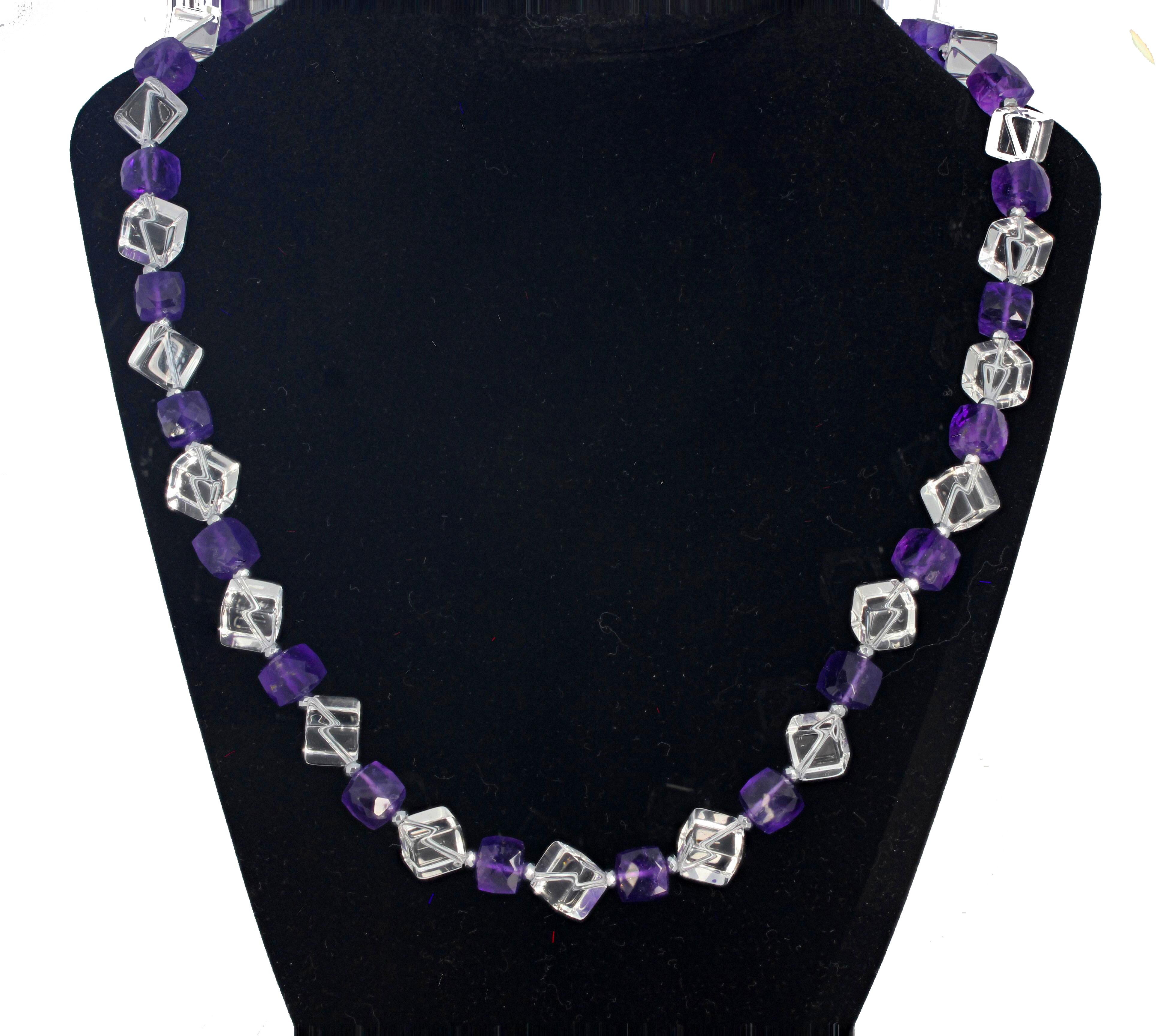This superbly elegant glittering natural cube cut clear Quartz necklace is enhanced  with checkerboard gem cut natural Amethysts.  The Quartz cubes are 9mm x 9mm and the clasp is a sterling silver plated easy-to-use hook on this 20 1/4 inch long