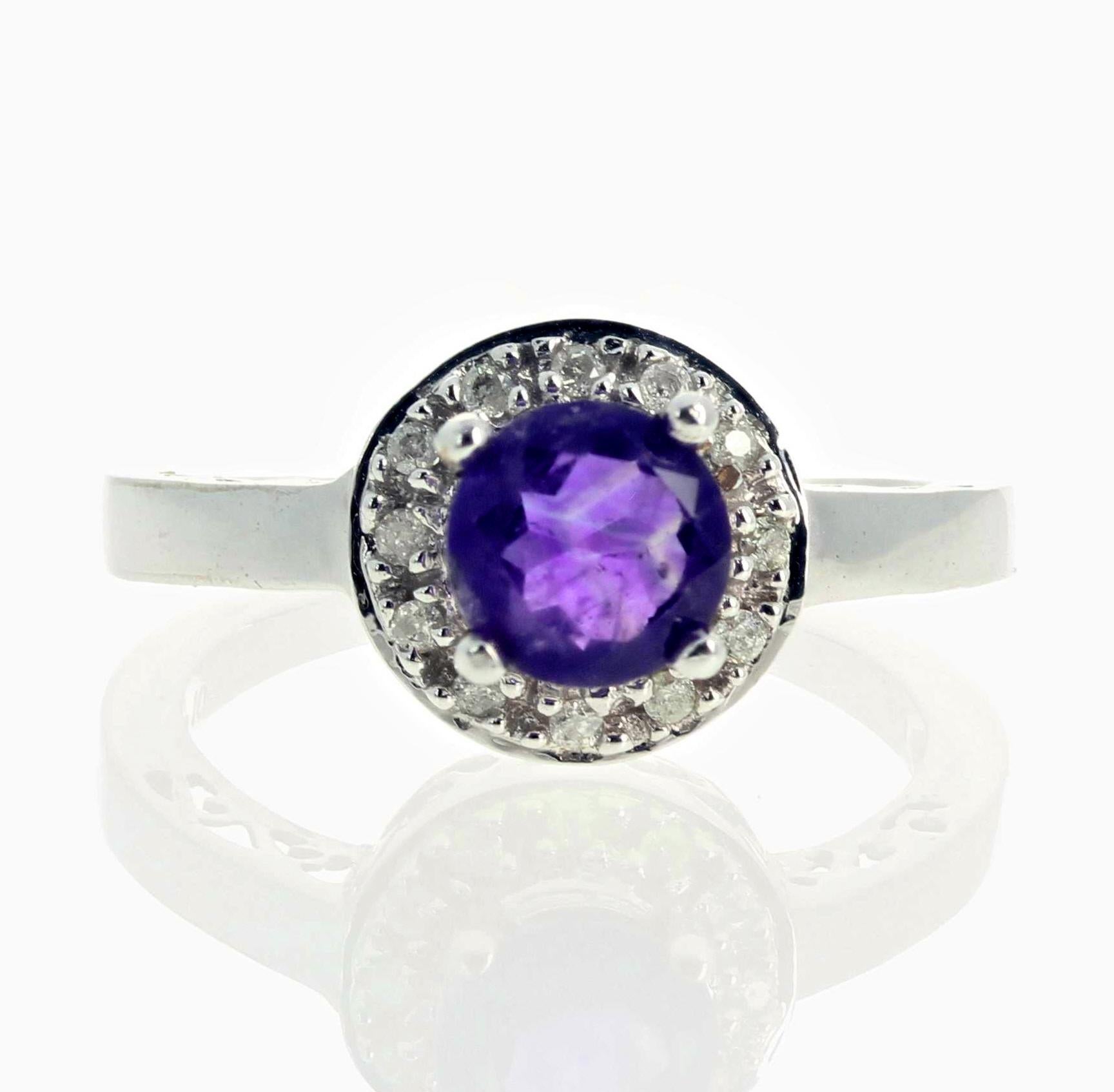 This beautiful petite dazzling Amethyst (6 mm - 0.6 carats) and 0.10 carats Diamond ring set in a classic 10K white gold ring size 7 (sizable).  This is a perfect gift for someone on their special day. 