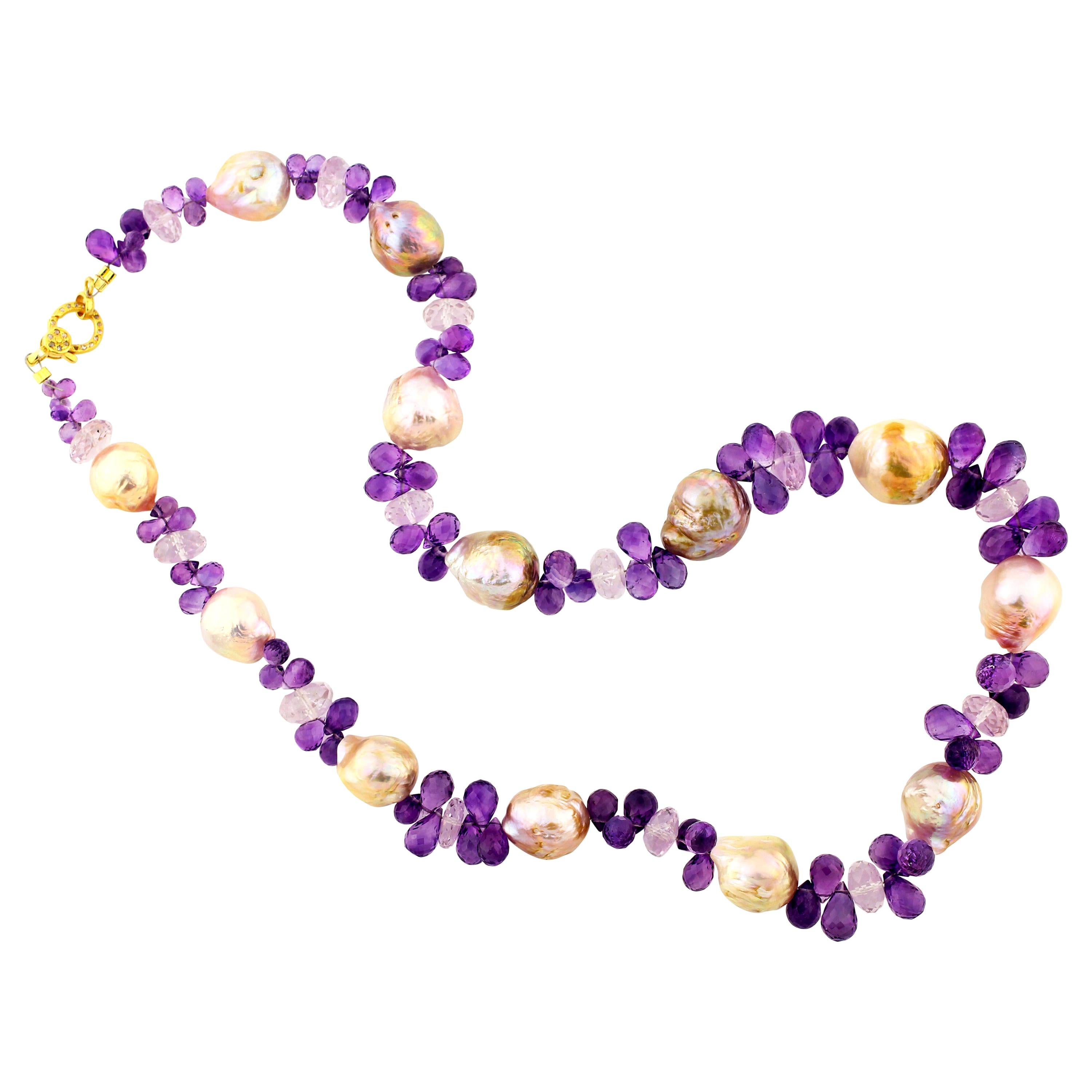 These fresh water cultured goldy tone Real Wrinkle Pearls are enhanced with sparkling checkerboard gem cut Amethyst Briolets and glittering Rose of France gemstones.  They are set with a Vermeil (sterling silver gold plated) clasp inset with tiny