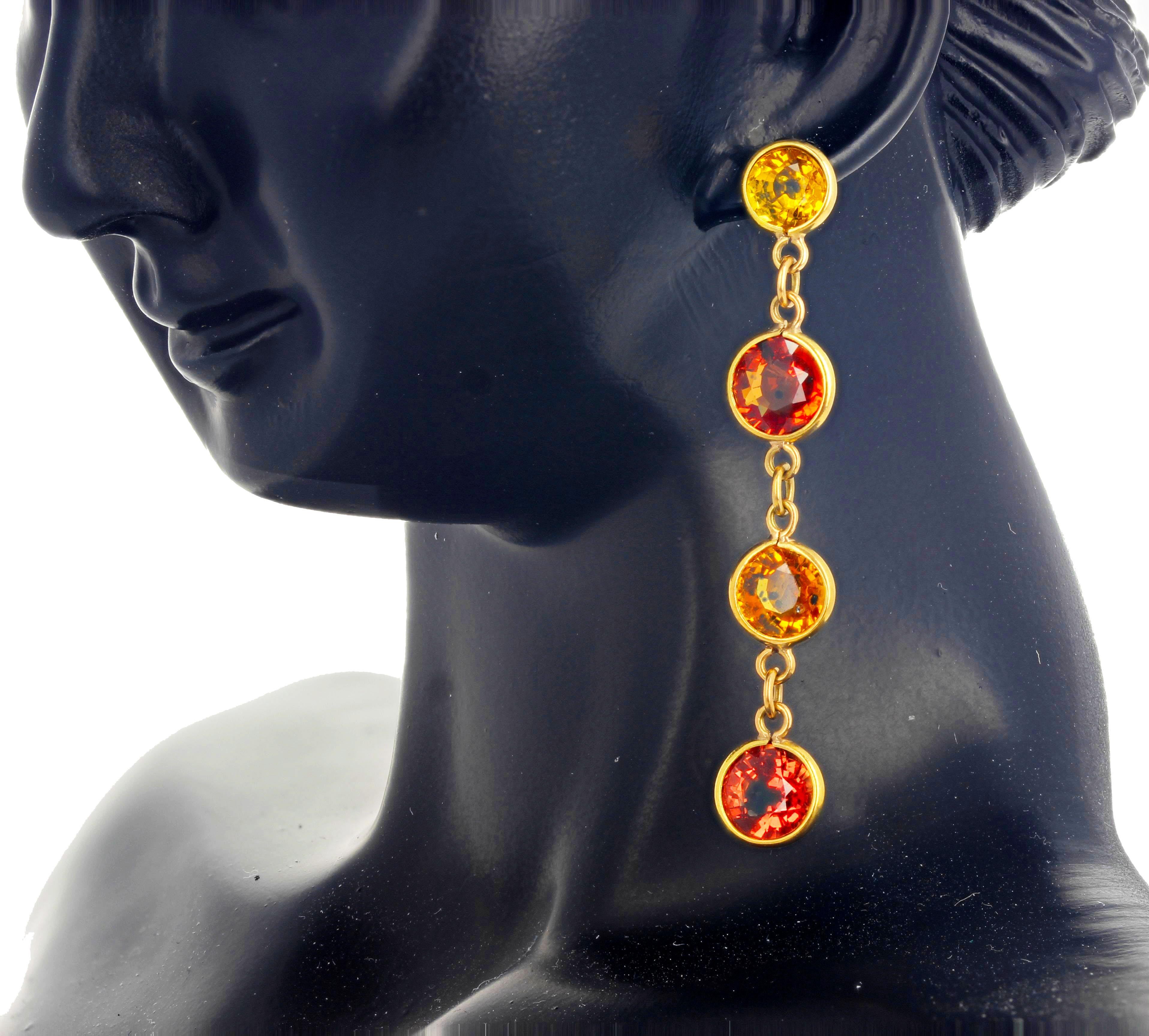 Brilliant natural rare type of Songea Sapphires set in 18Kt yellow gold dangle stud earrings.  They hang approximately 1 1/2 inches long and are approximately 1 carat each. (the gemstones are approximately 5 mm each).  Spectacular optical effect in