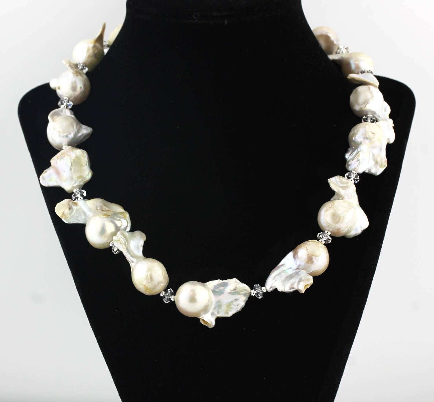 The slightly graduated huge glistening unique Baroque Pearls are enhanced by chunks of polished silver quartz gems and gemstones on this handmade necklace..  One of the Pearls glows a bit more than the others but creates more drama and beauty. 