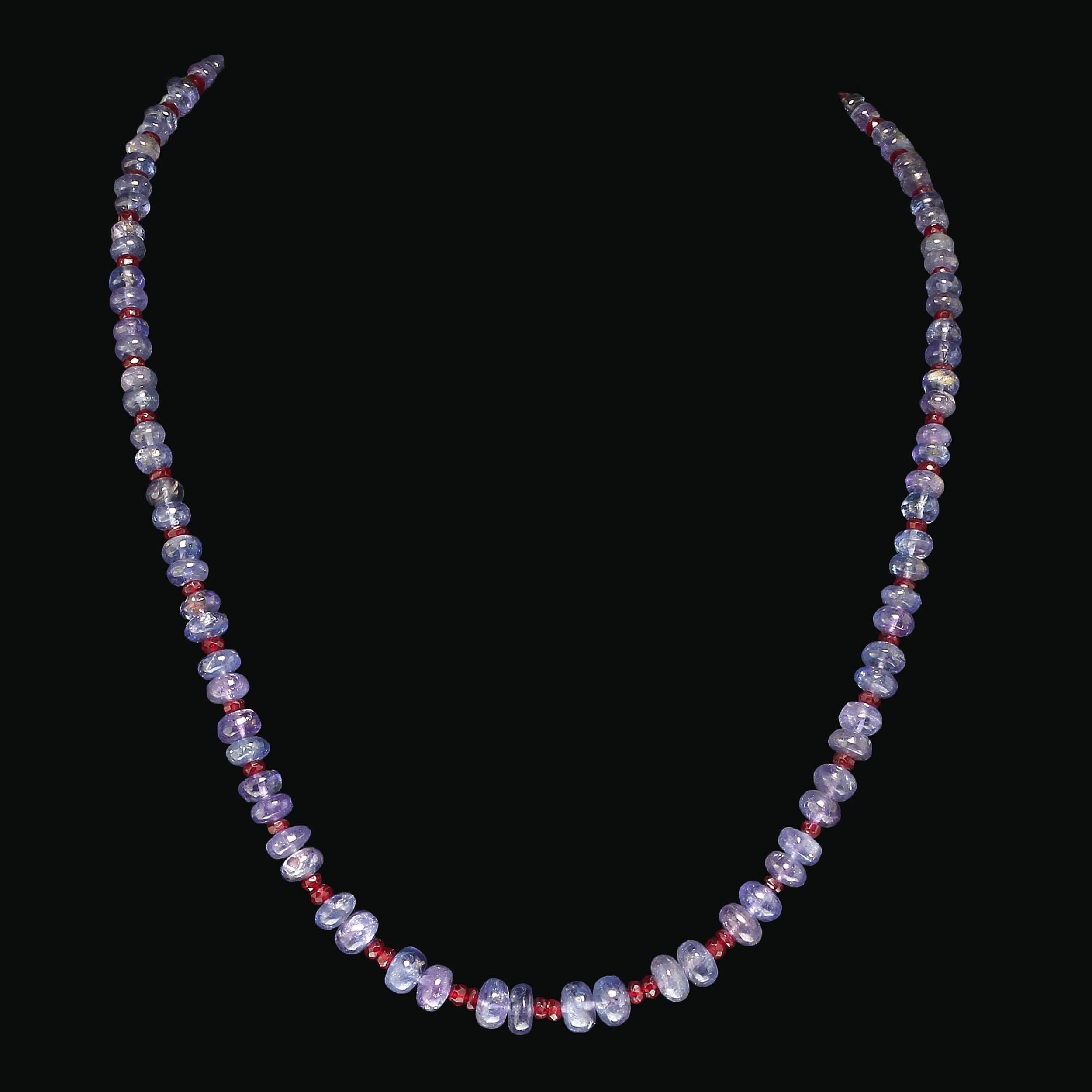 Delicate necklace of smoothe rondelles of translucent purple Tanzanite and faceted Ruby. Wear this gorgeous piece with all your favorite ensembles. The graduated Tanzanites range in size from 3 to 6 MM. The Rubies are 3 MM. This lovely 17 inch