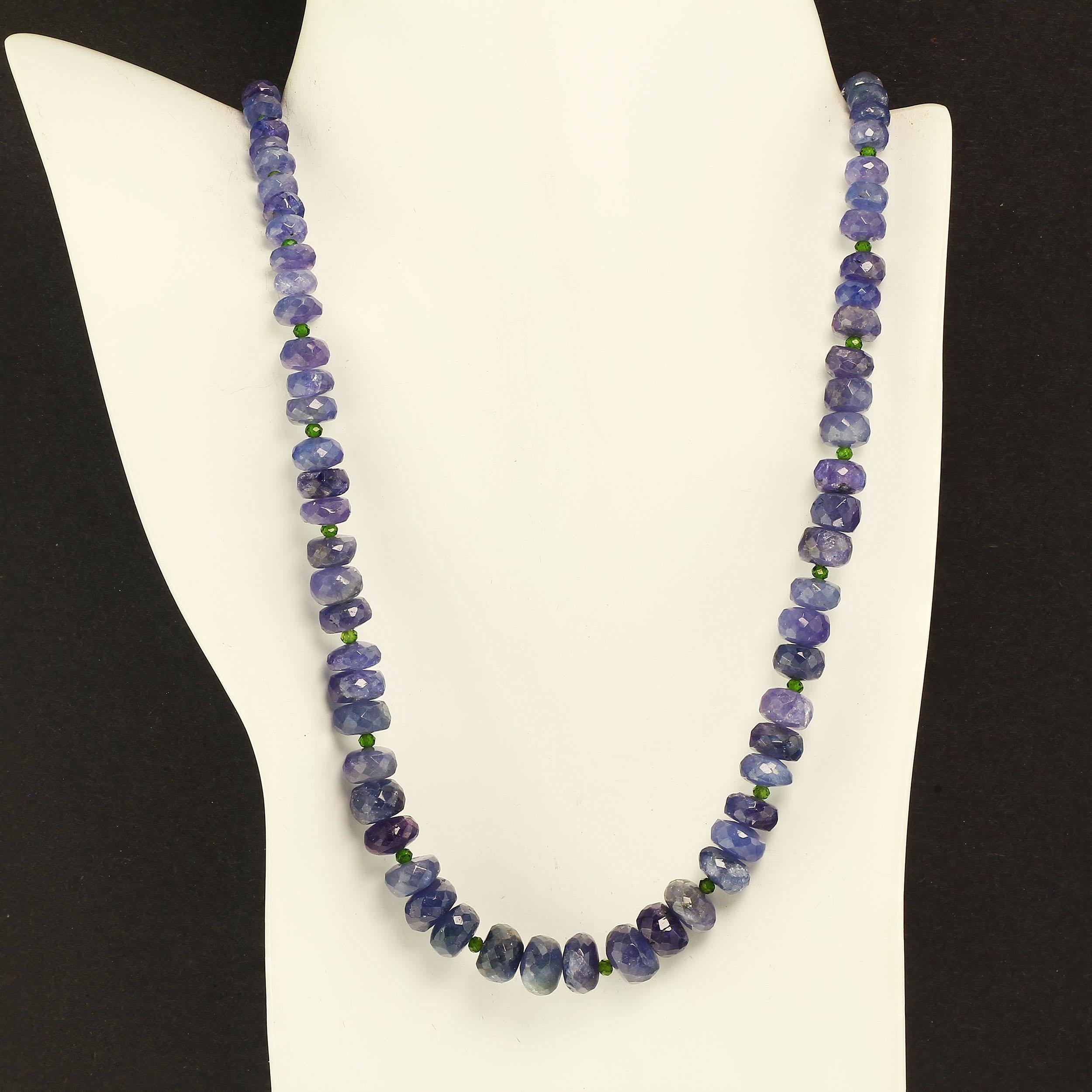 Unique necklace of graduated Tanzanite rondelles accented with sparkling green Chrome Diopside. This lovely blue/purple necklace is the essence of Tanzanite color. The faceted, translucent rondelles flash and dance in the light. They graduate from 6