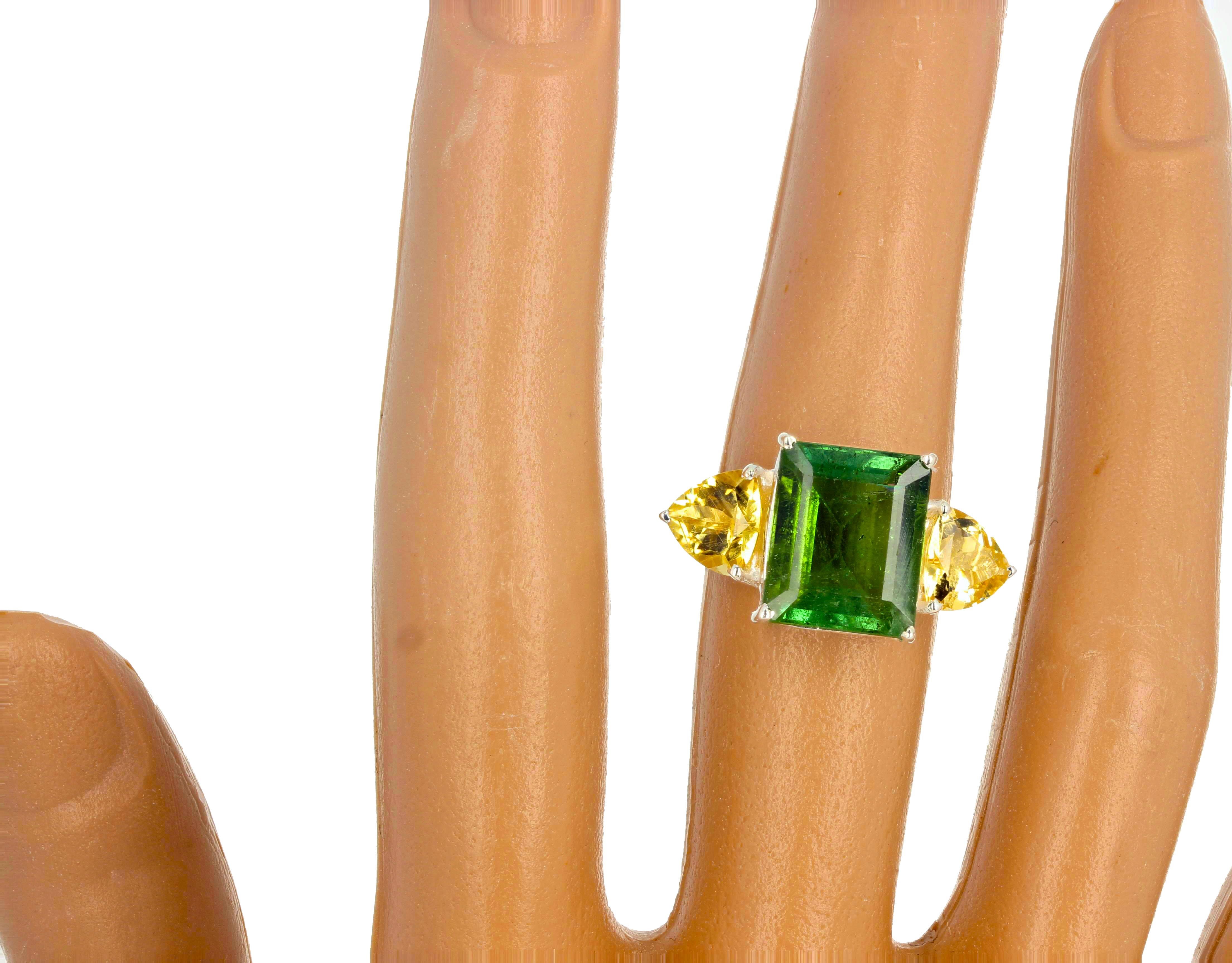 Elegant classic 6.5 carat stunning natural green Tourmaline (12.5 mm x 10.2 mm) and fiery yellow 1.9 carats of natural Citrines.  This ring is set in sterling silver rhodium plated size  7 sizable for free.  If you wish faster delivery on your