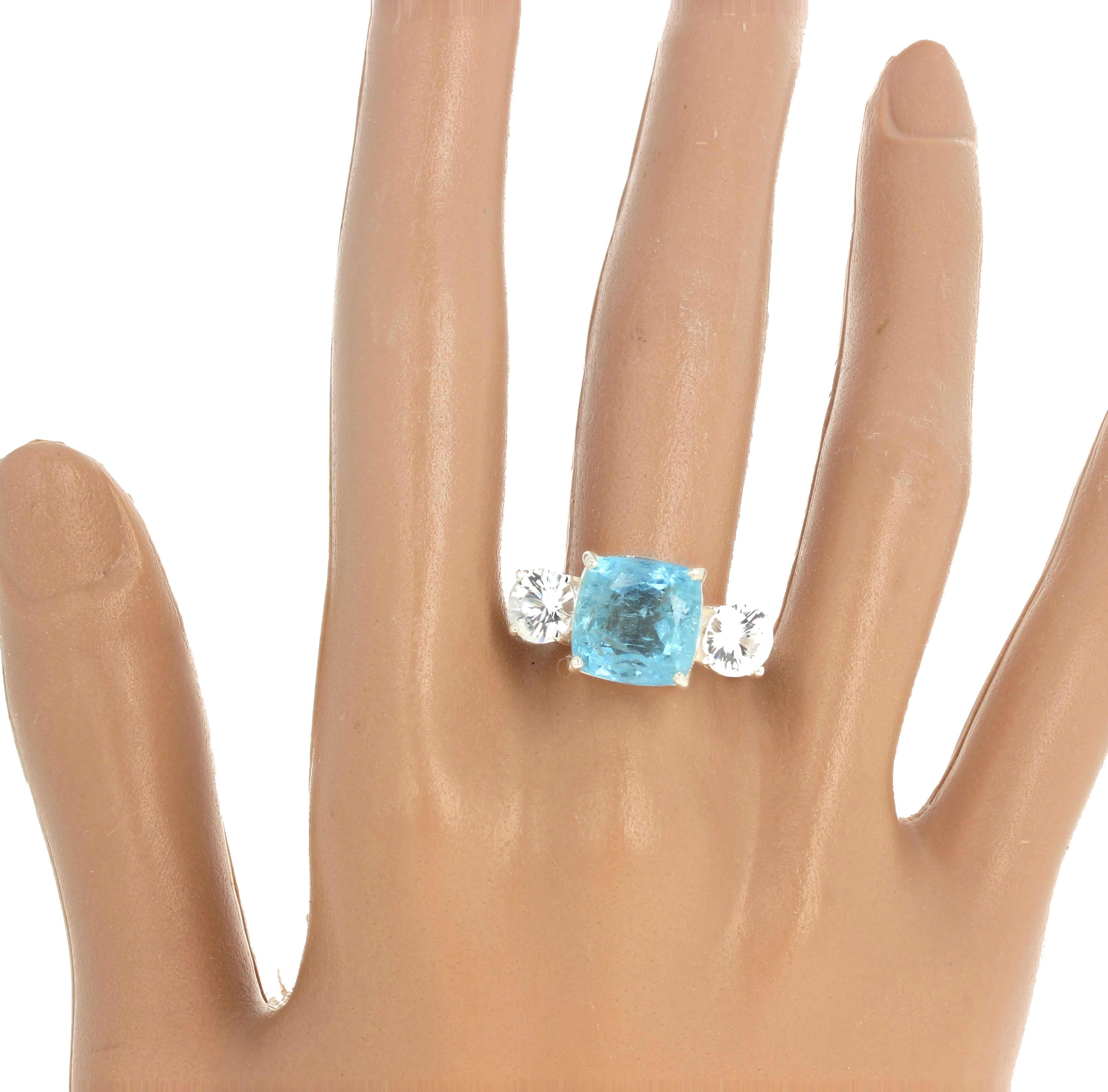 This classic blue 6.76 carat Aquamarine ring is set with 2.62 carats of intense white glittering natural Cambodian Zircons.  Although full of natural inclusions this ring is really beautifully bright and happy.  The ring is sterling silver rhodium