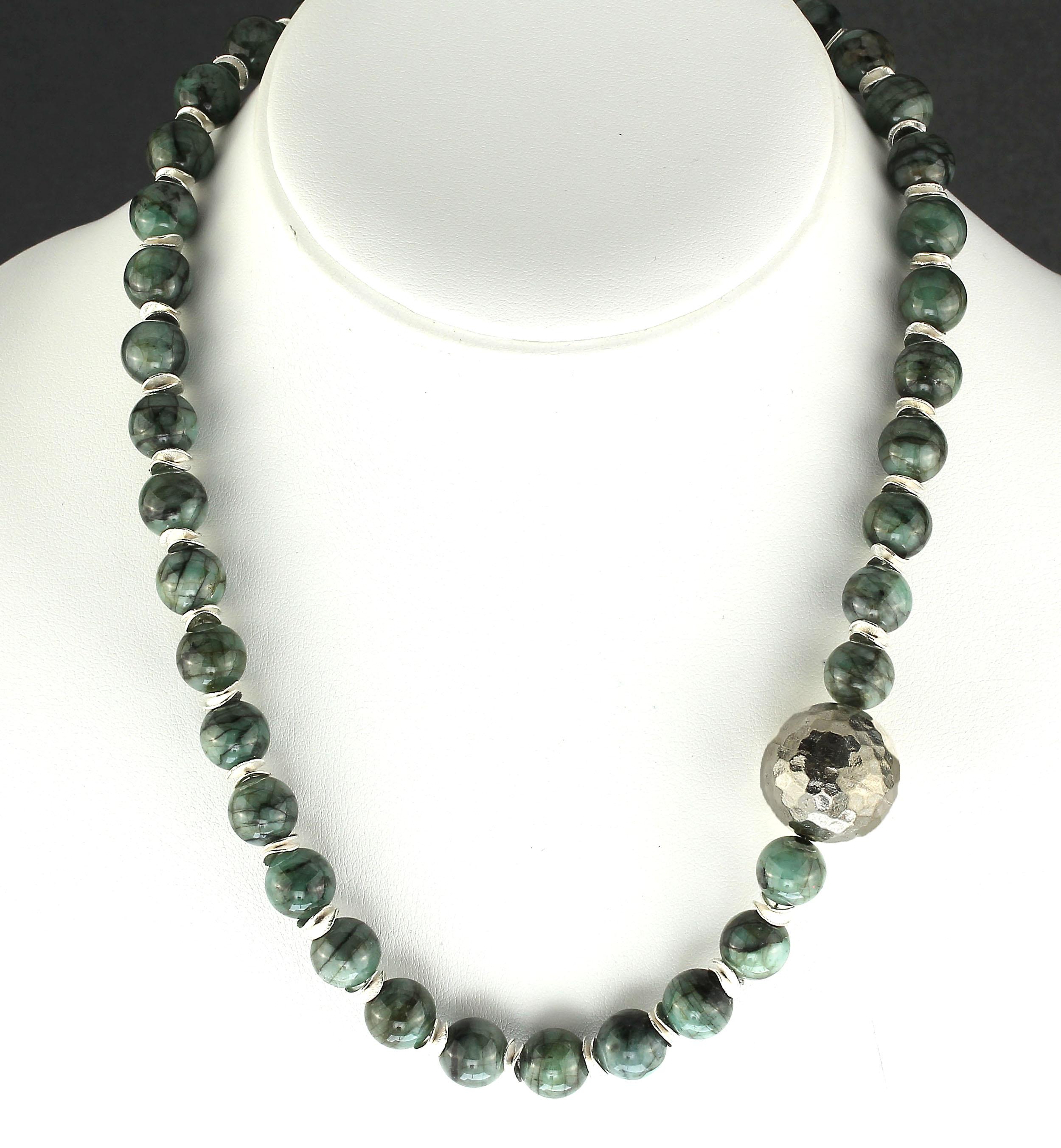 One of a kind Emerald in matrix necklace accented with pure Silver 20 MM faceted focal which is just off the front center for interest. These 10 MM highly polished Emerald in matrix are enhanced with silver tone flutters. This unique Gemjunky