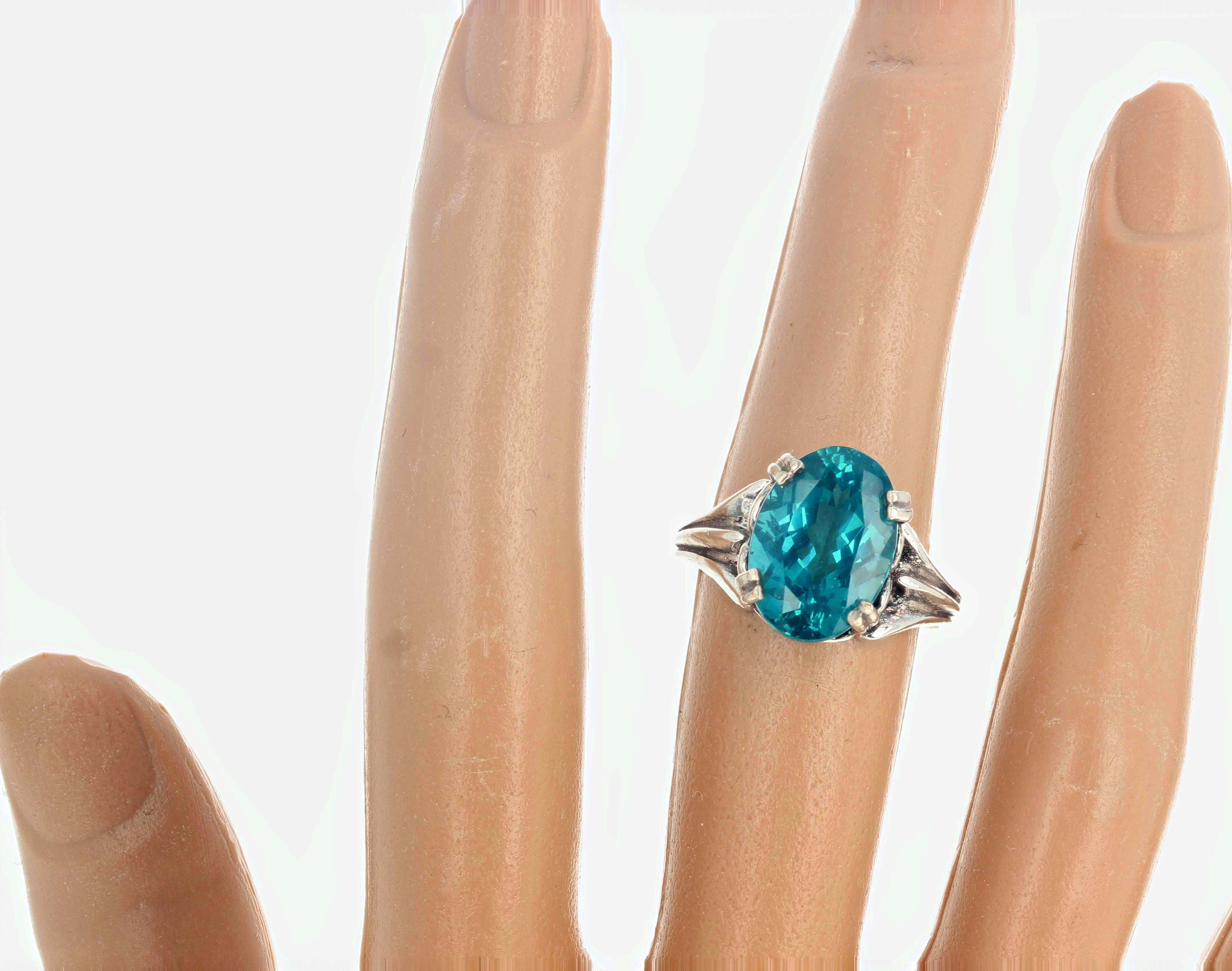 This stunning fiery turquoise blue color 5.7 carat natural Apatite is 14mm x 10mm and sparkles intensely in this classic solitaire sterling silver ring size 7 (sizable for free).  This gemstone and its intense color come from the famous mine of