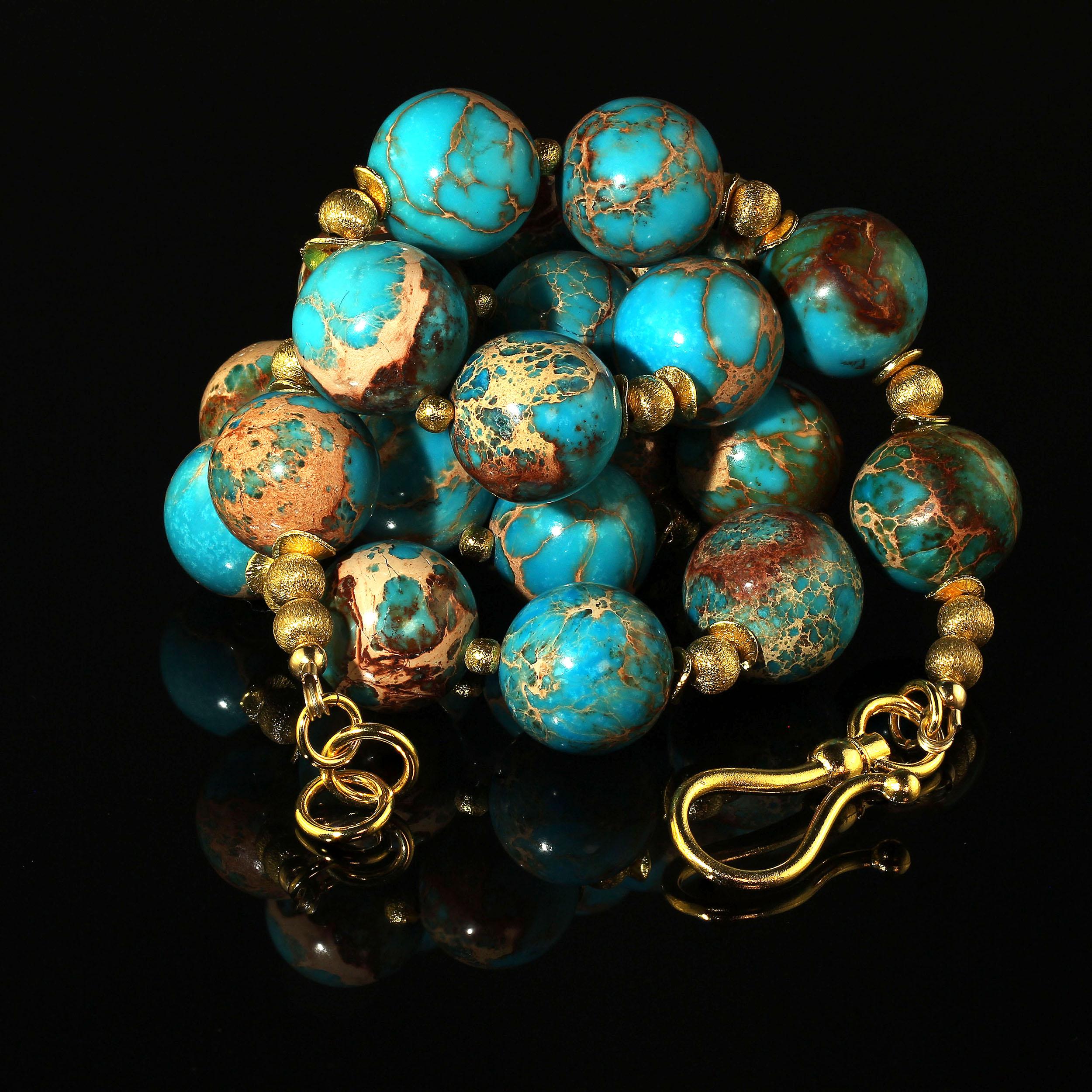 Fun loving turquoise color Desert Jasper and goldy accents necklace.  This 23 inch necklace is perfect to enhance all winter colors.  Wear this with black, brown, blue, and wow, red and green. These 18 MM Desert Jasper are lovely mottled turquoise,