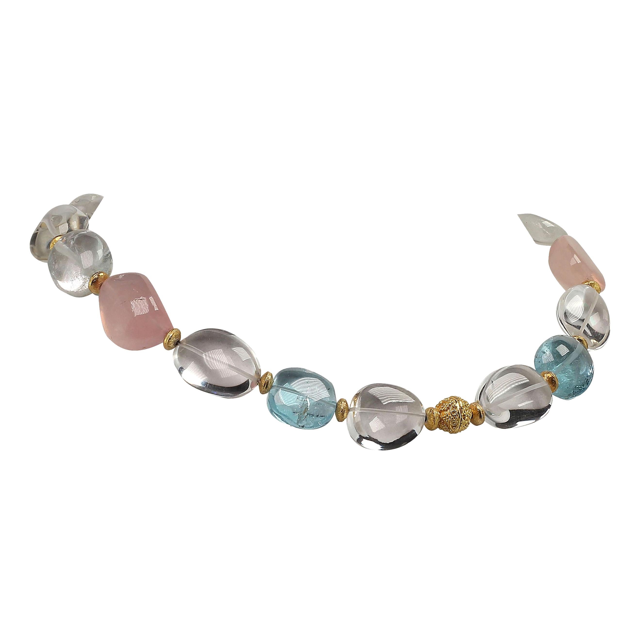 Handmade, unique necklace in lovely highly polished transparent quartz crystal. The clear, blue, and pink nuggets are enhanced with rich goldy accents.  This 17 inch necklace is secured with a 24K gold dura plate hook and eye.  Remember that