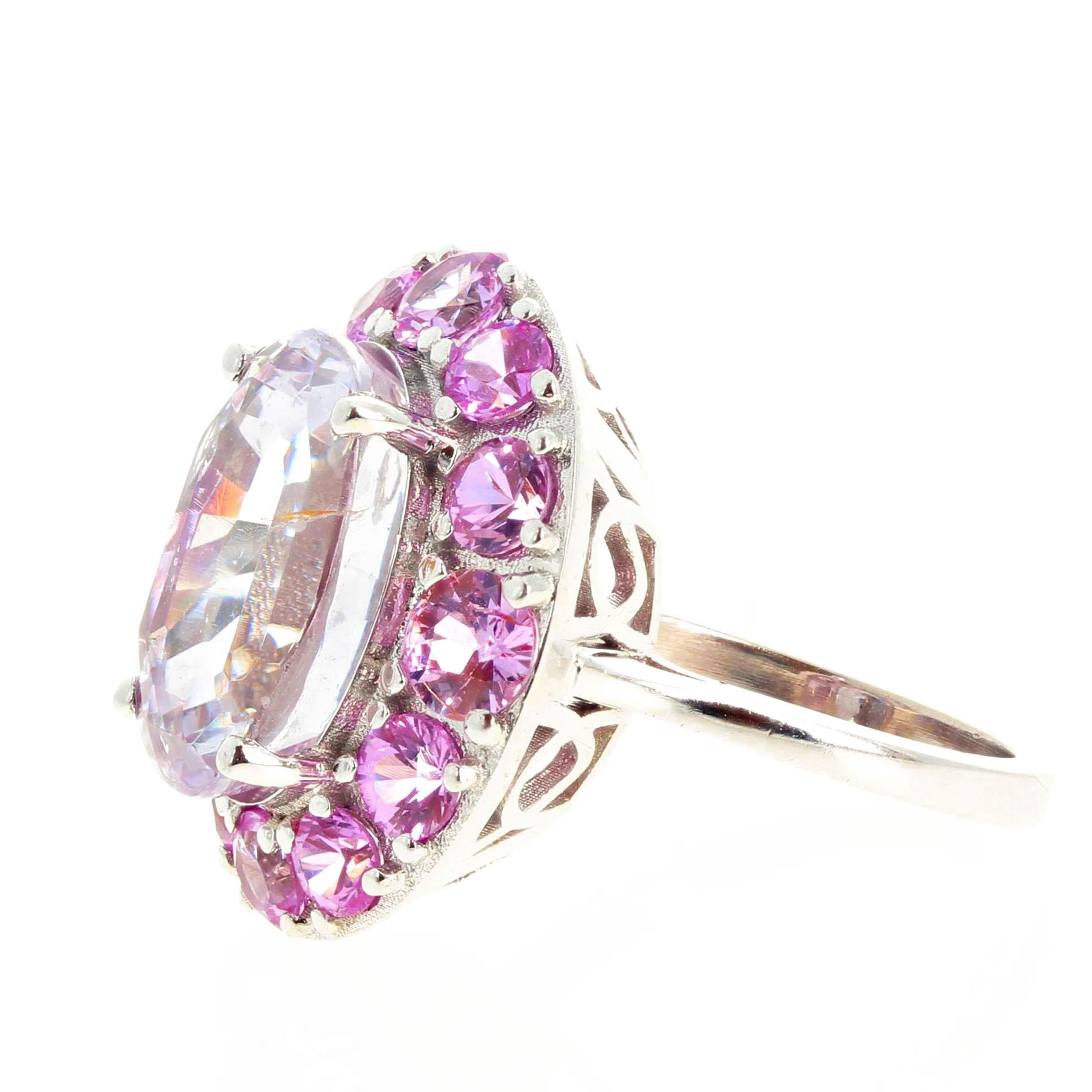This ring will absolutely blow your mind ! In all of my design years I have rarely come upon a gemstone as beautiful and CLEAR as this Kunzite.  Magnificent glowing natural 10 carat pink Kunzite enhanced with glittering natural pink Sapphires set in