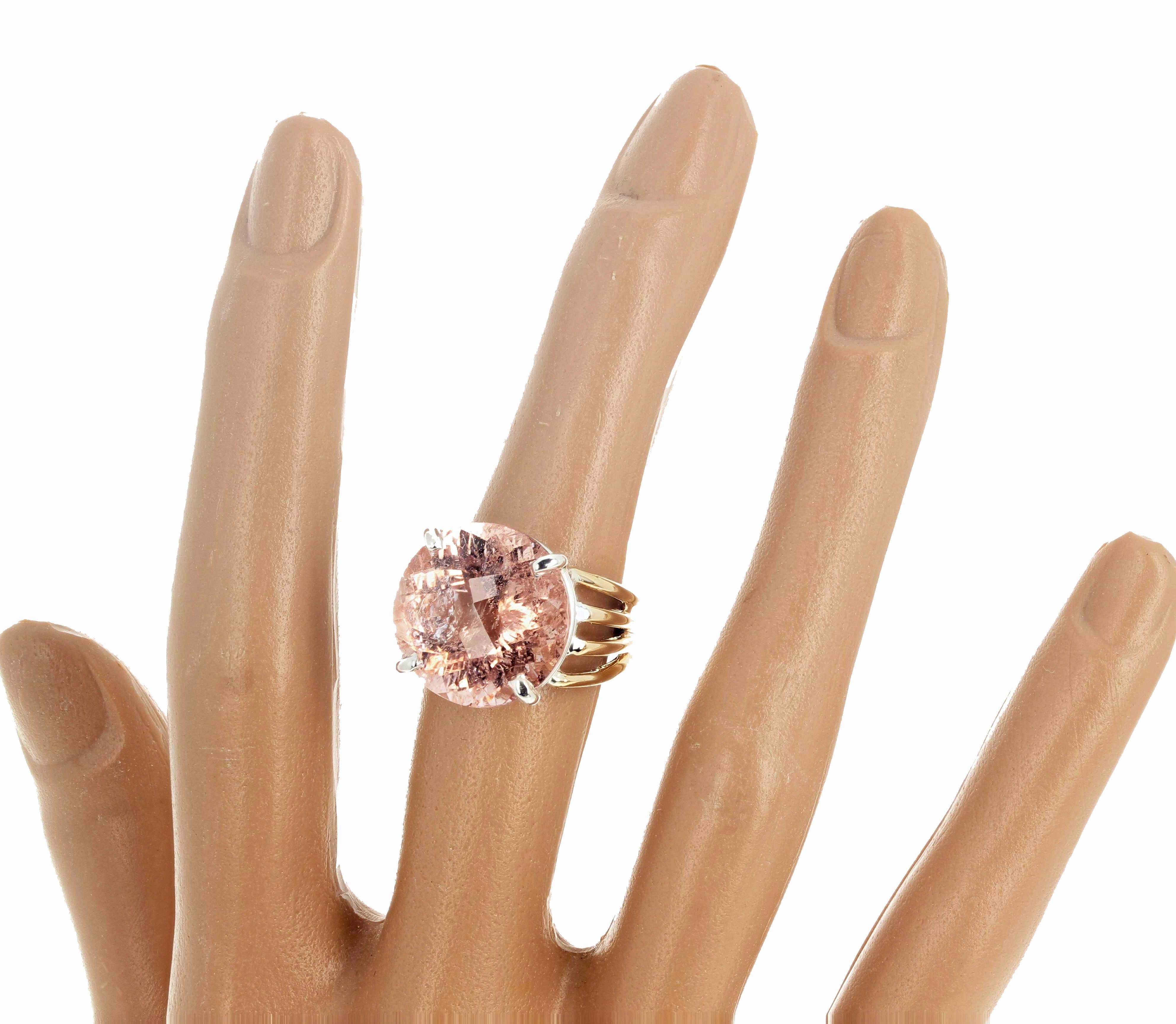 Gorgeous intensely glittering 14.1 carat natural pink Morganite is 16mm and is set in a 14Kt yellow gold ring with sterling silver prongs.    It glitters so brightly that it is difficult to see the natural inclusions.  The ring is a size 7 (sizable