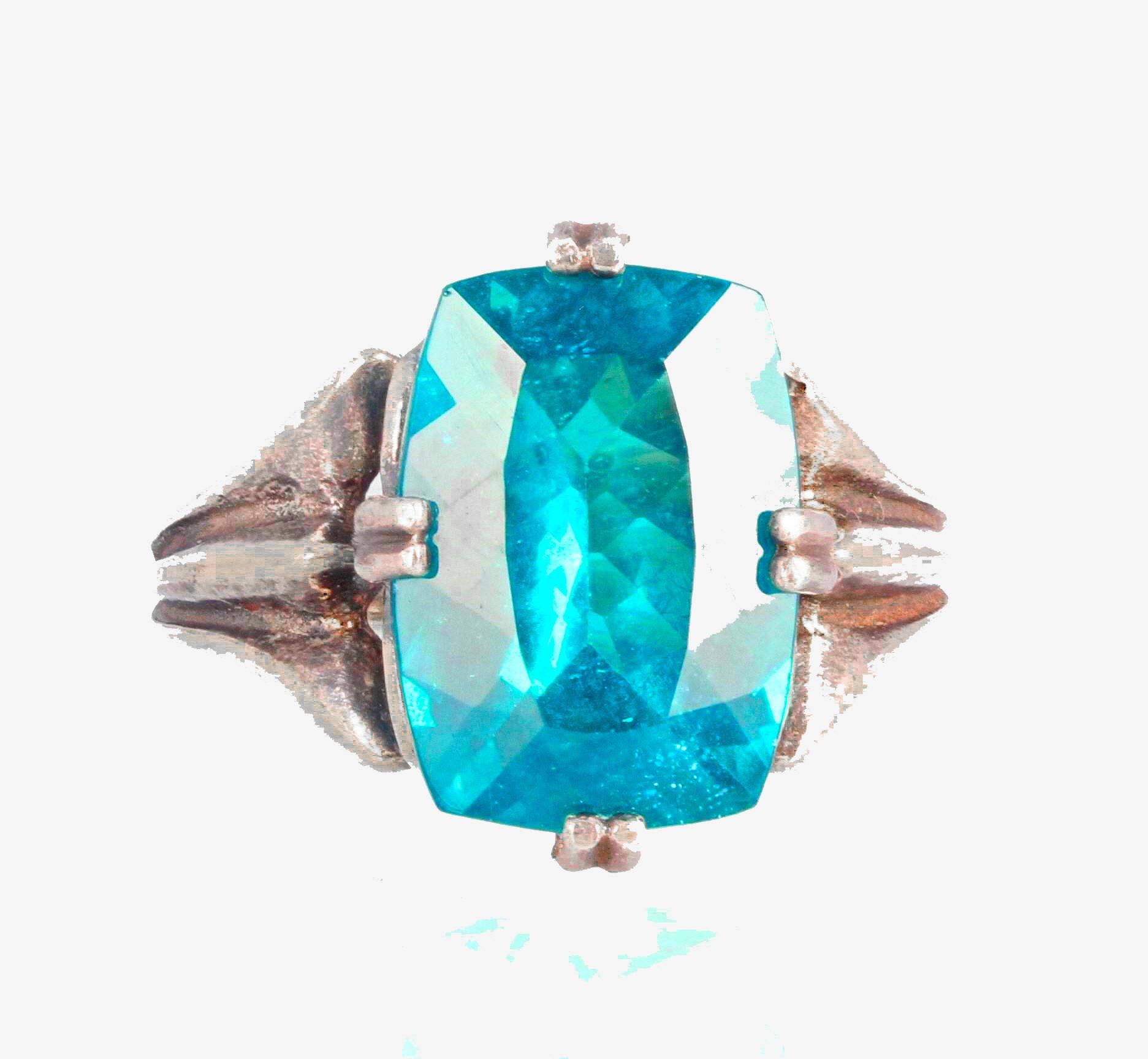 This glittering beautiful natural blue 6.4 carats natural unusually large Apatite (14mm x 10mm) is set in an interesting sterling silver ring size 7 (sizable for free).  This is the price of just the gemstone today.  As it copies the intense Paraiba