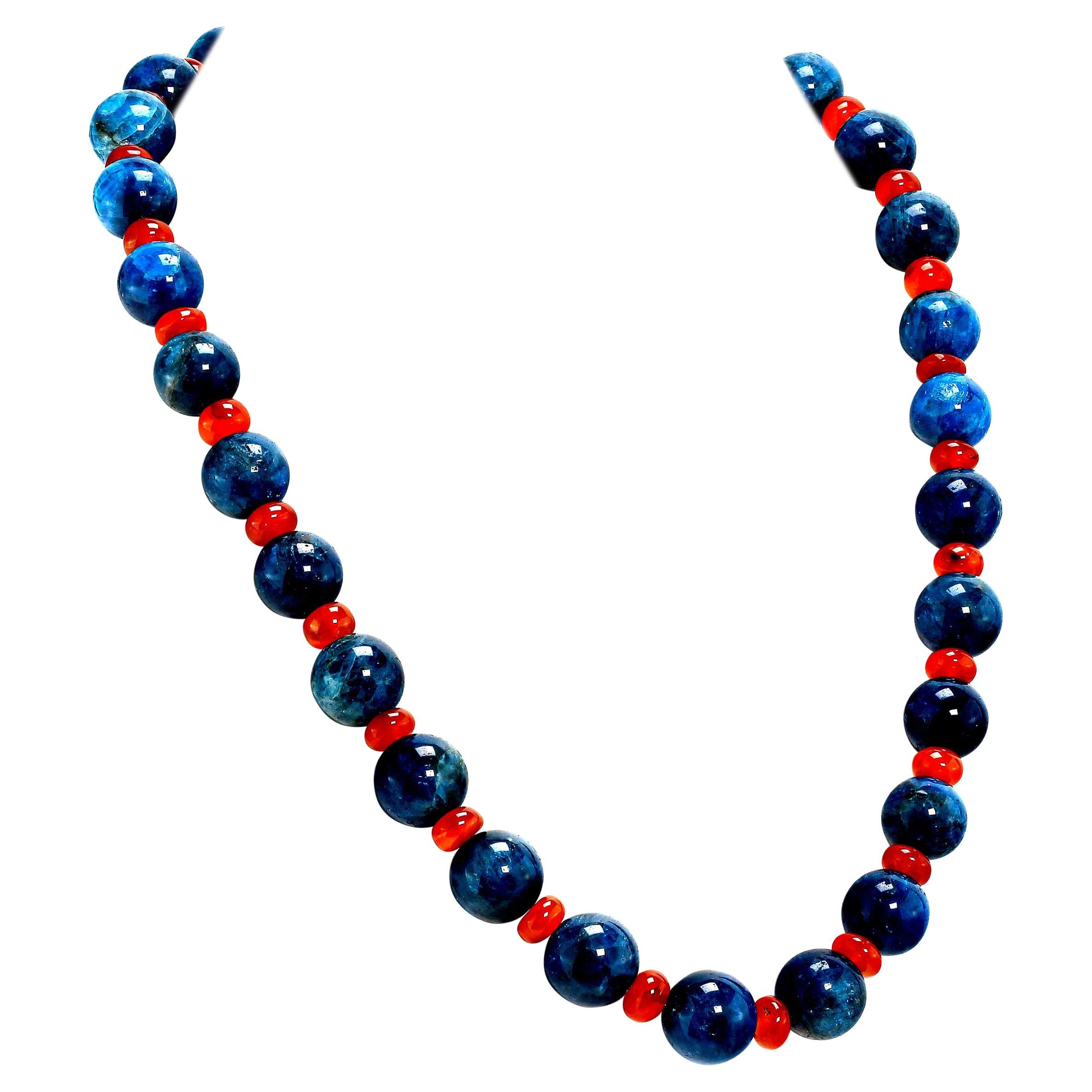 23 Inch Necklace of Teal Apatite Beads (15mm) that have interesting variations in intensity of color and veining.  The highly polished Apatite Beads alternate with Glowing Translucent Carnelian Rondelles (9mm).  The combination is more than the sum