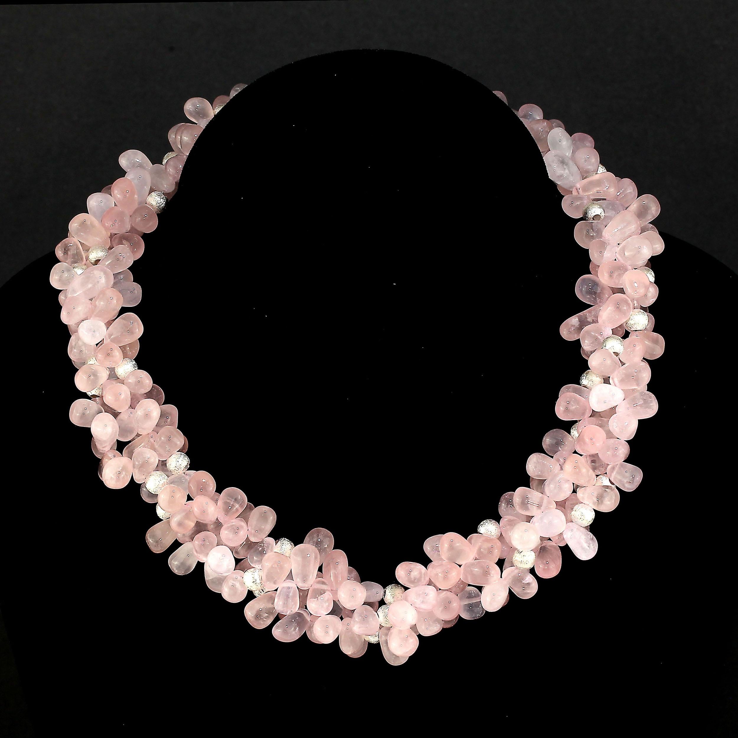 Choker length triple strand of Rose Quartz briolettes.  These lovely smooth briolettes are highly polished and just glow.  Each strand has brushed silver tone accents.  This 17 inch  necklace is secured with a sterling silver hook.  What a great