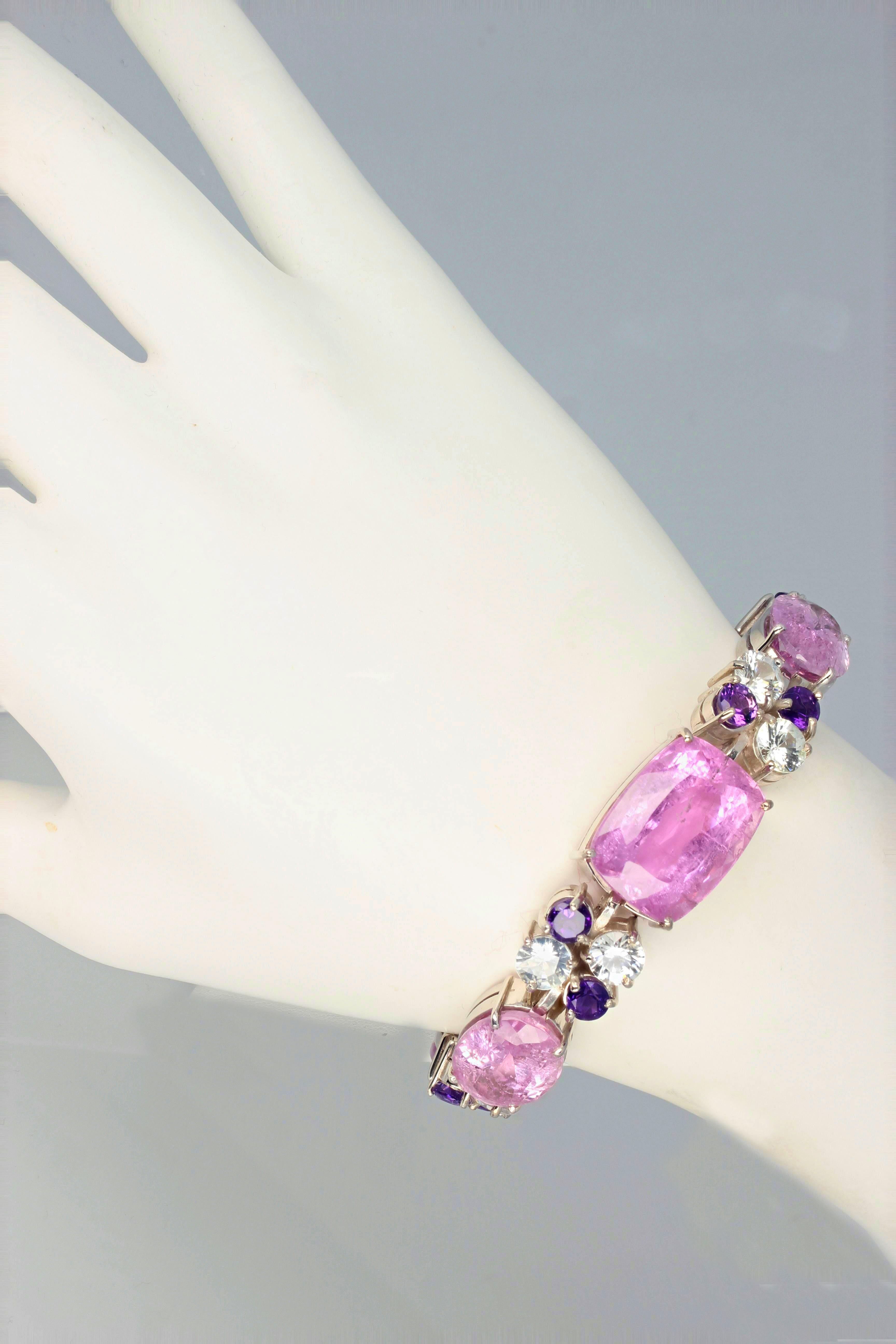 This amazing bracelet is set with the main center 24 carat natural Kunzite (20mm x 15mm) enhanced with brilliant white diamond cut natural Topaz  and little natural glittering Amethysts.  Set in this beautiful Sterling Silver bracelet it is 7 inches