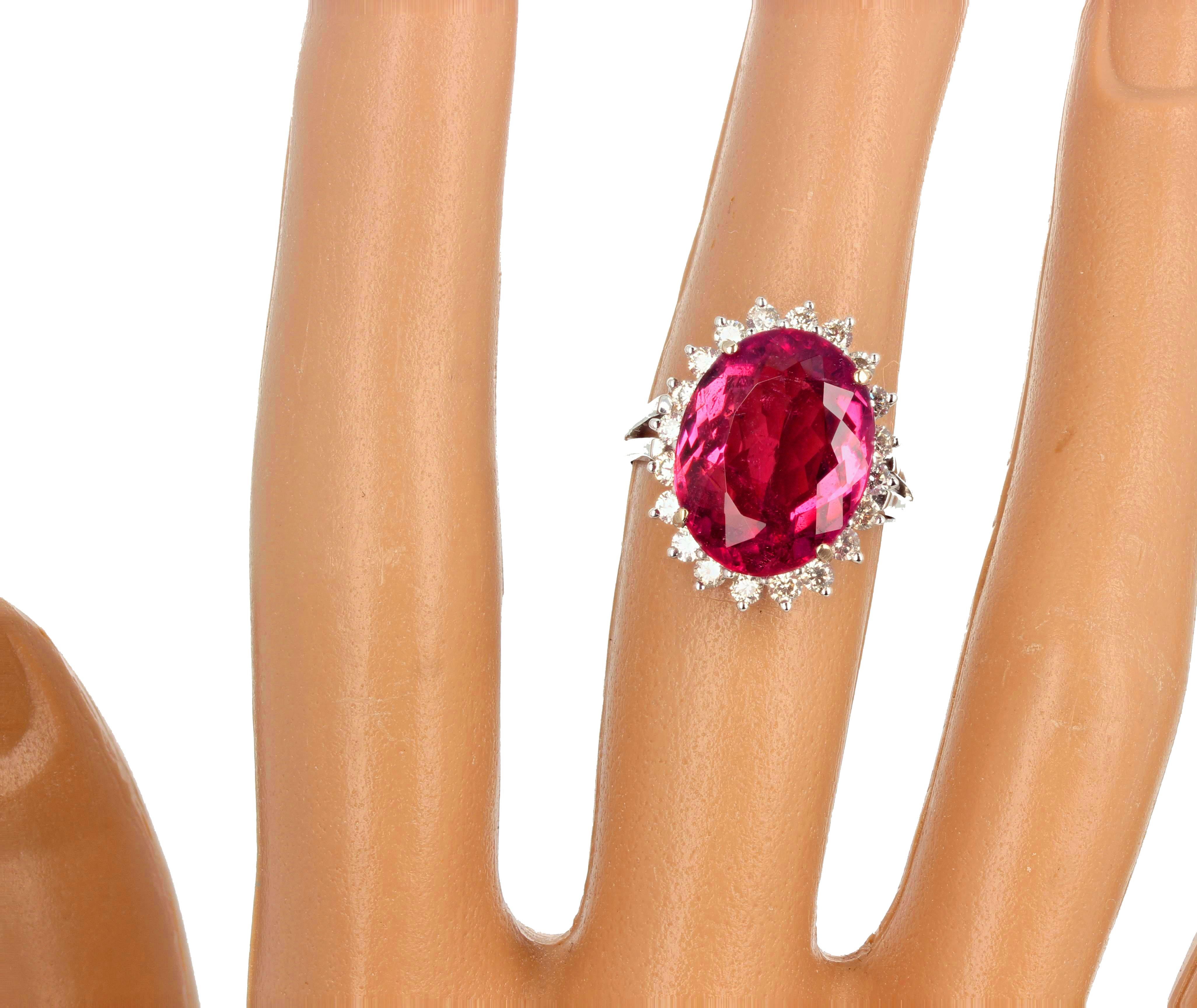 Beautiful red with pinky tone 6.5 carat natural Tourmaline enhanced with 19 glittering little white diamonds set in this 14Kt white gold ring size 7 (sizable).  There are no eye visible inclusions in this gorgeous pinkyred Tourmaline.  This