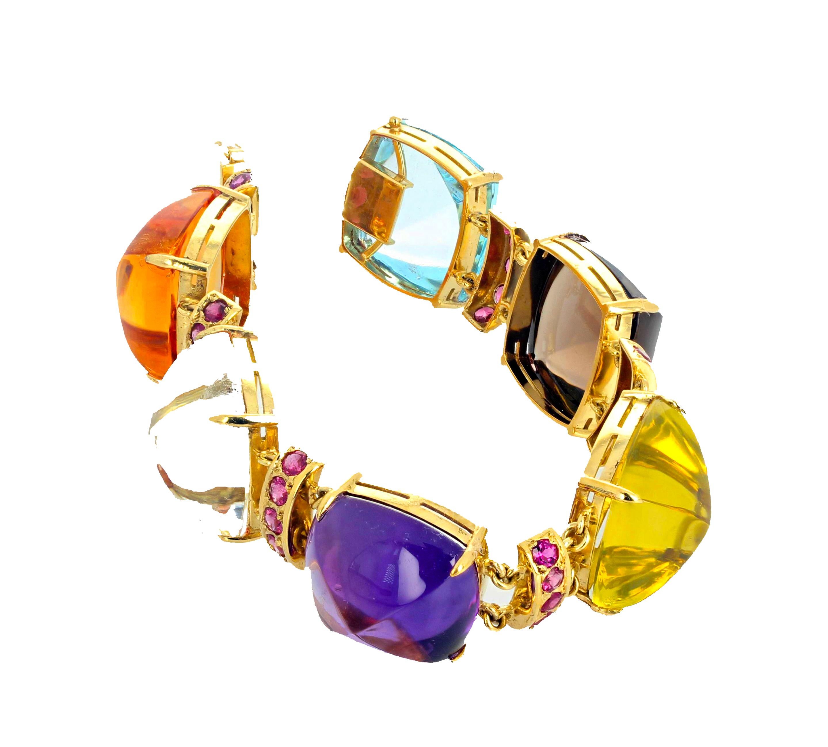 This eye catching 18Kt yellow gold bracelet is 7.25 inches long.  Each of the large gemstones - Citrine, Silver Quartz, Amethyst, Lemon Quartz, Smoky Quartz and Blue Topaz -  is approximately 20 mm x 19.5 mm and are enhanced by the brilliant